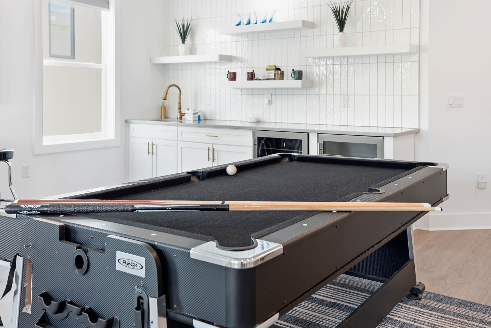 120 Dune Drive – Game room with a pool table, kitchenette, and large windows.