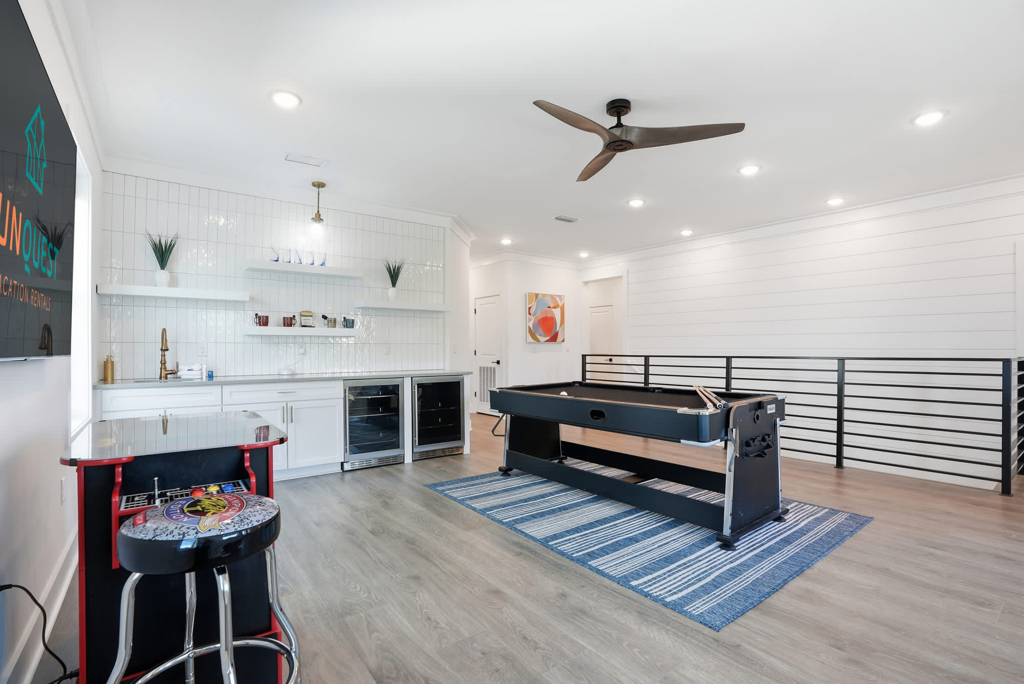 120 Dune Drive – Game room with a pool table, bar area, and modern decor.