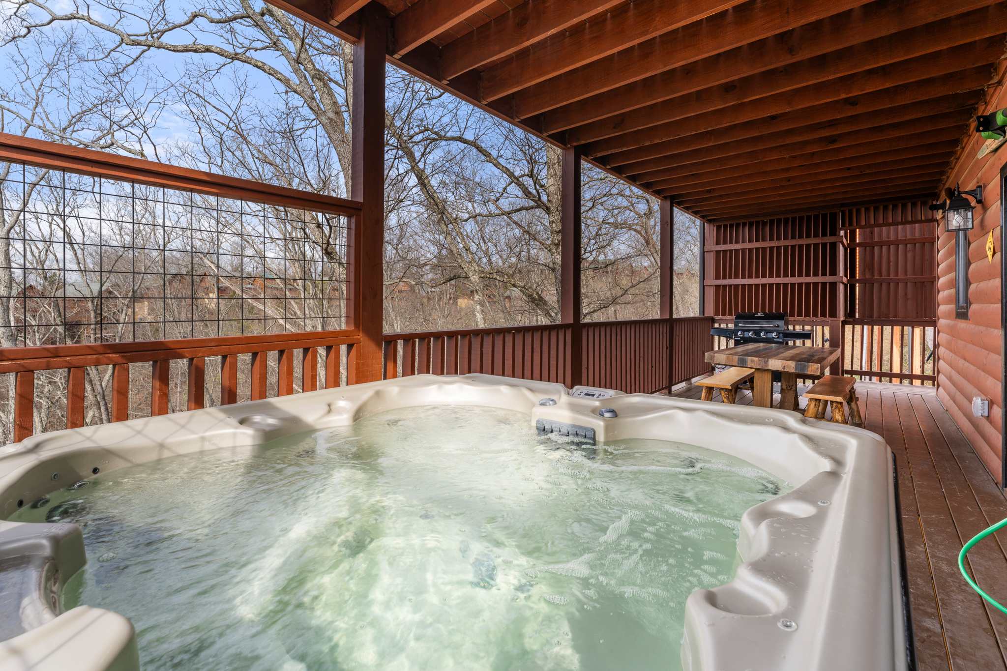 Soak the day away with treetop views in the private hot tub
