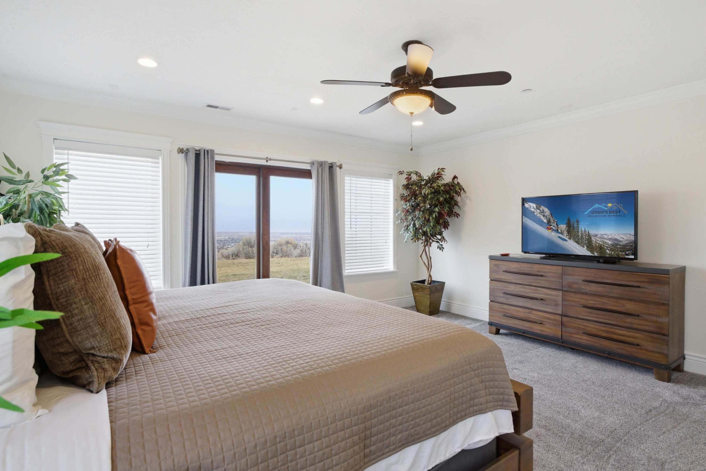 Cozy guest bedroom with warm tones and mountain views