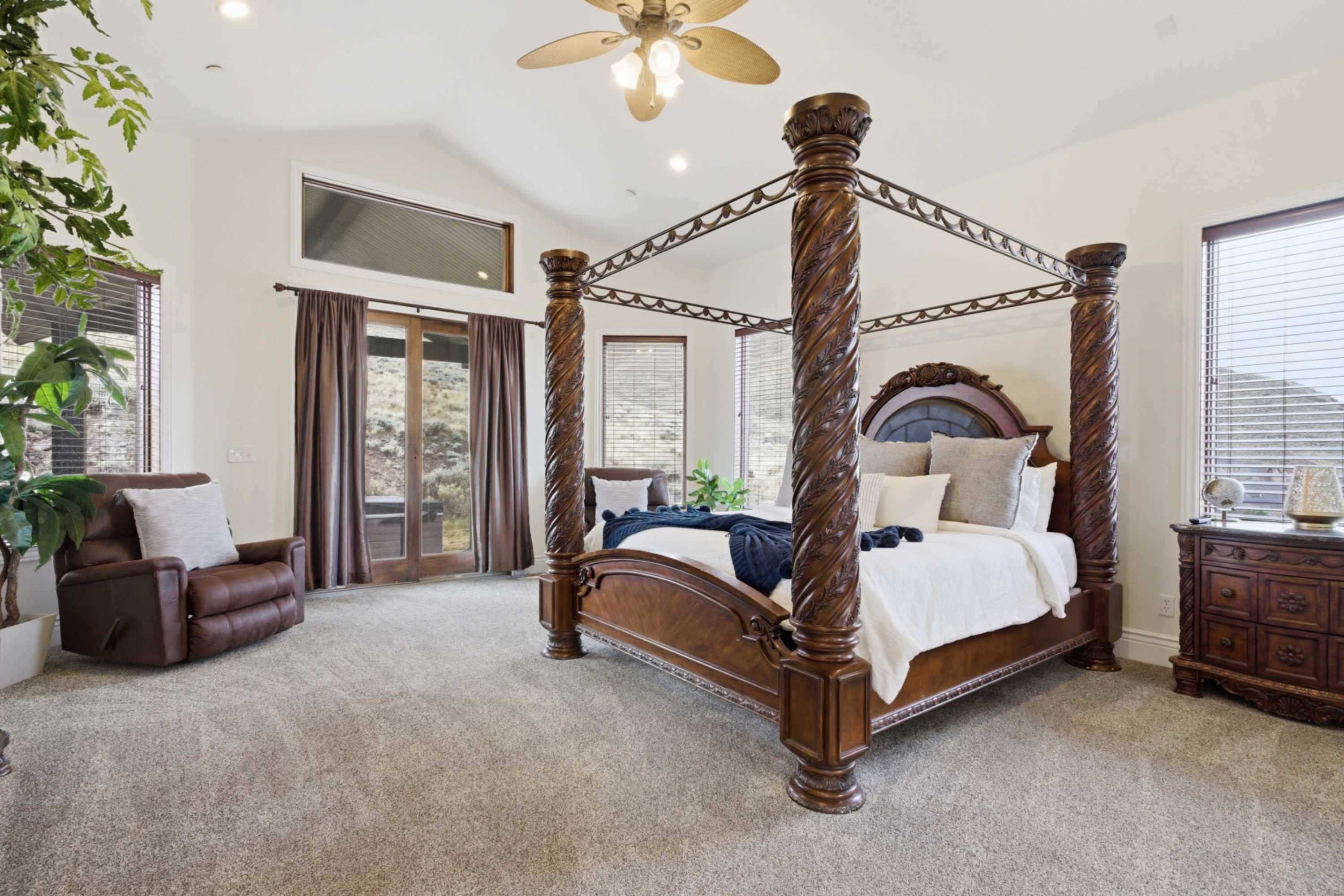 Comfortable primary bedroom with plush bedding and private access