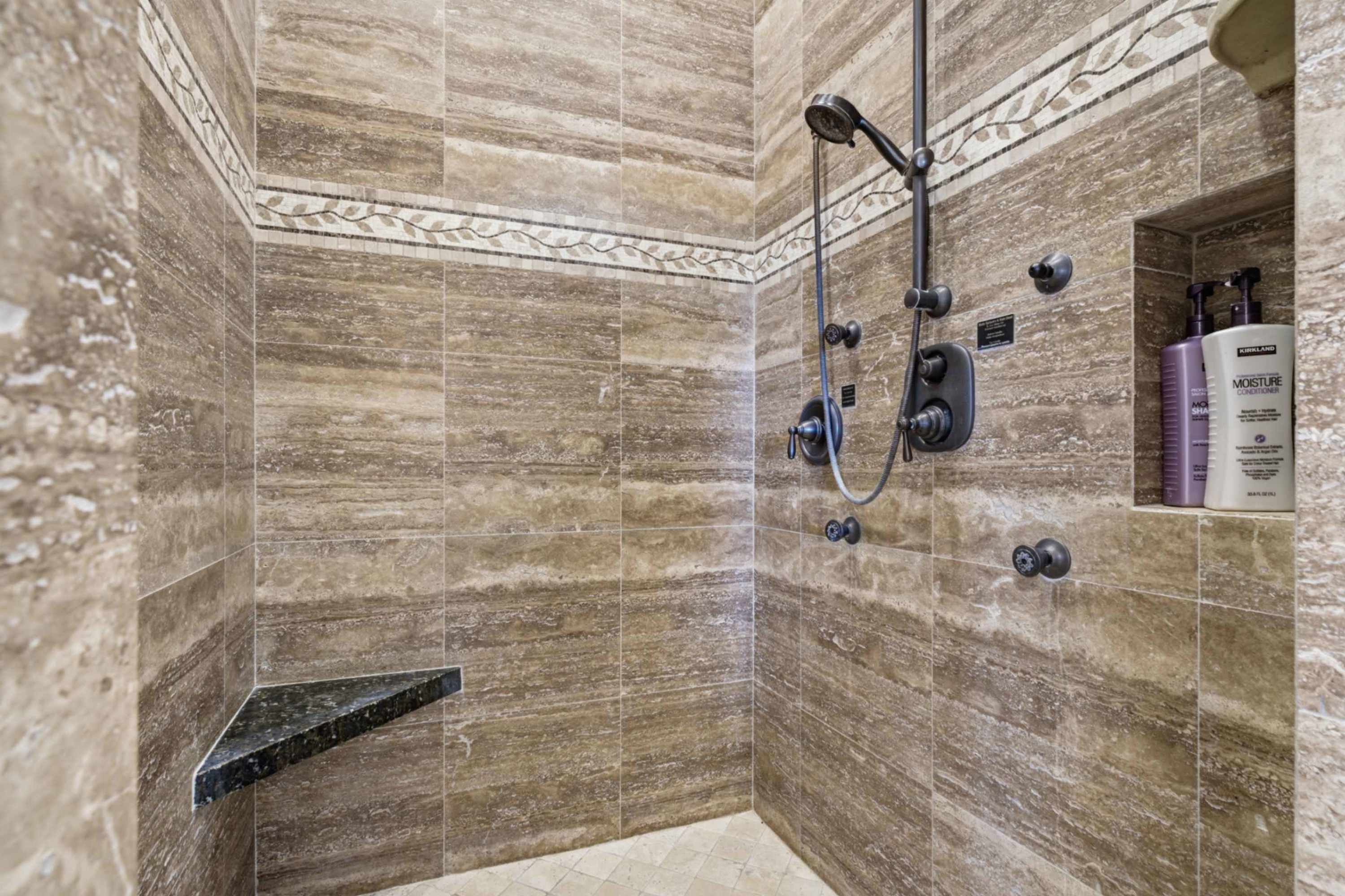 Walk-in tiled shower with modern finishes