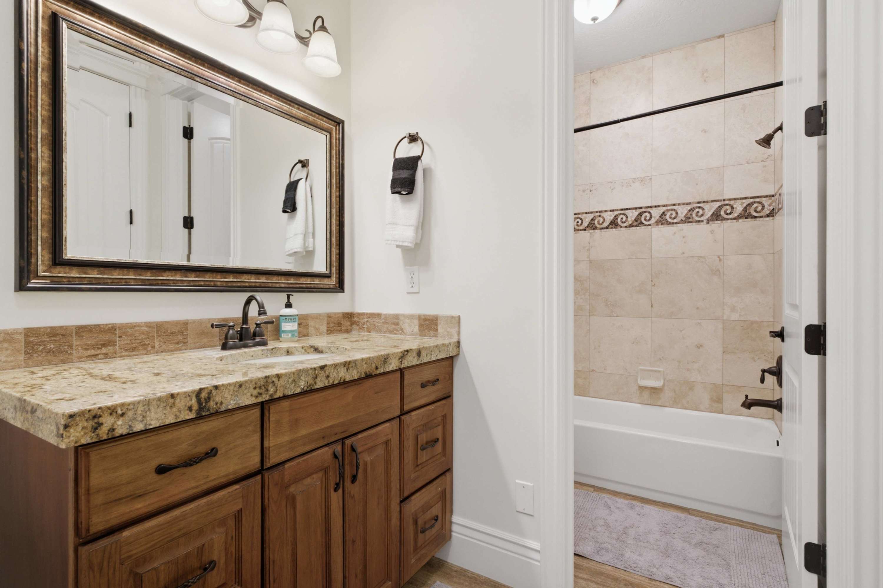Full bathroom with detailed tilework and modern finishes