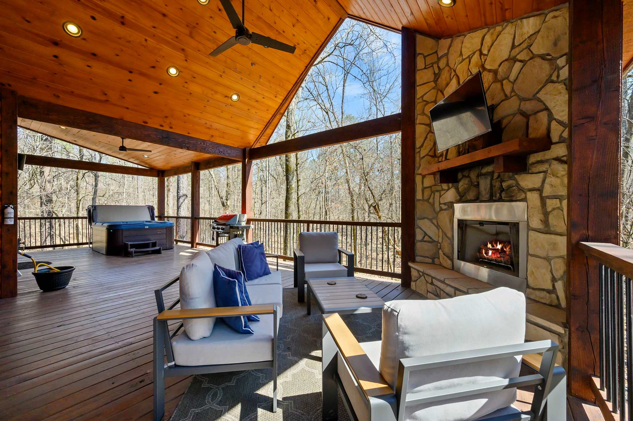 Your ultimate outdoor retreat – hot tub, fireplace, and entertainment all in one