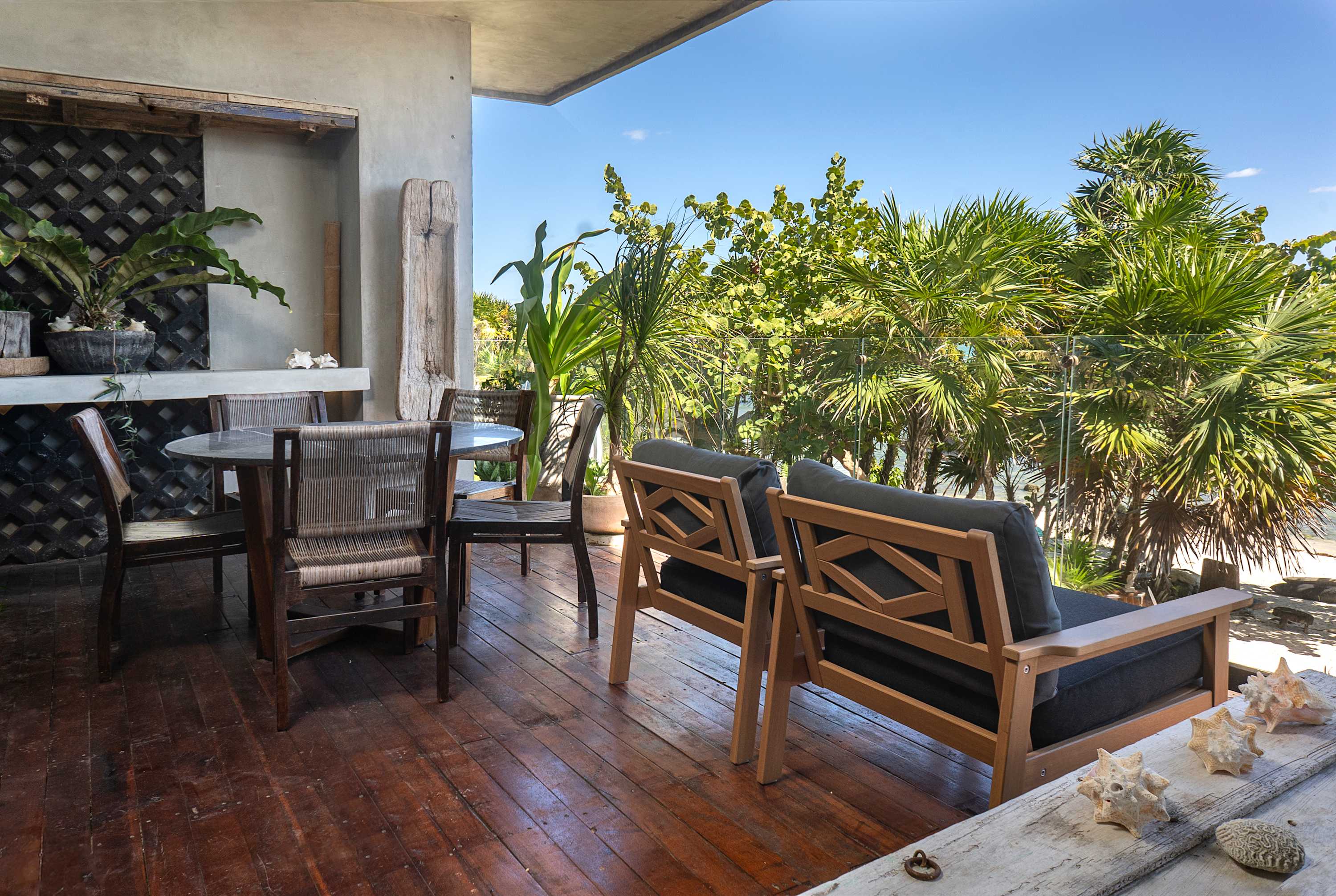 Private balcony with ocean view and outdoor dining area