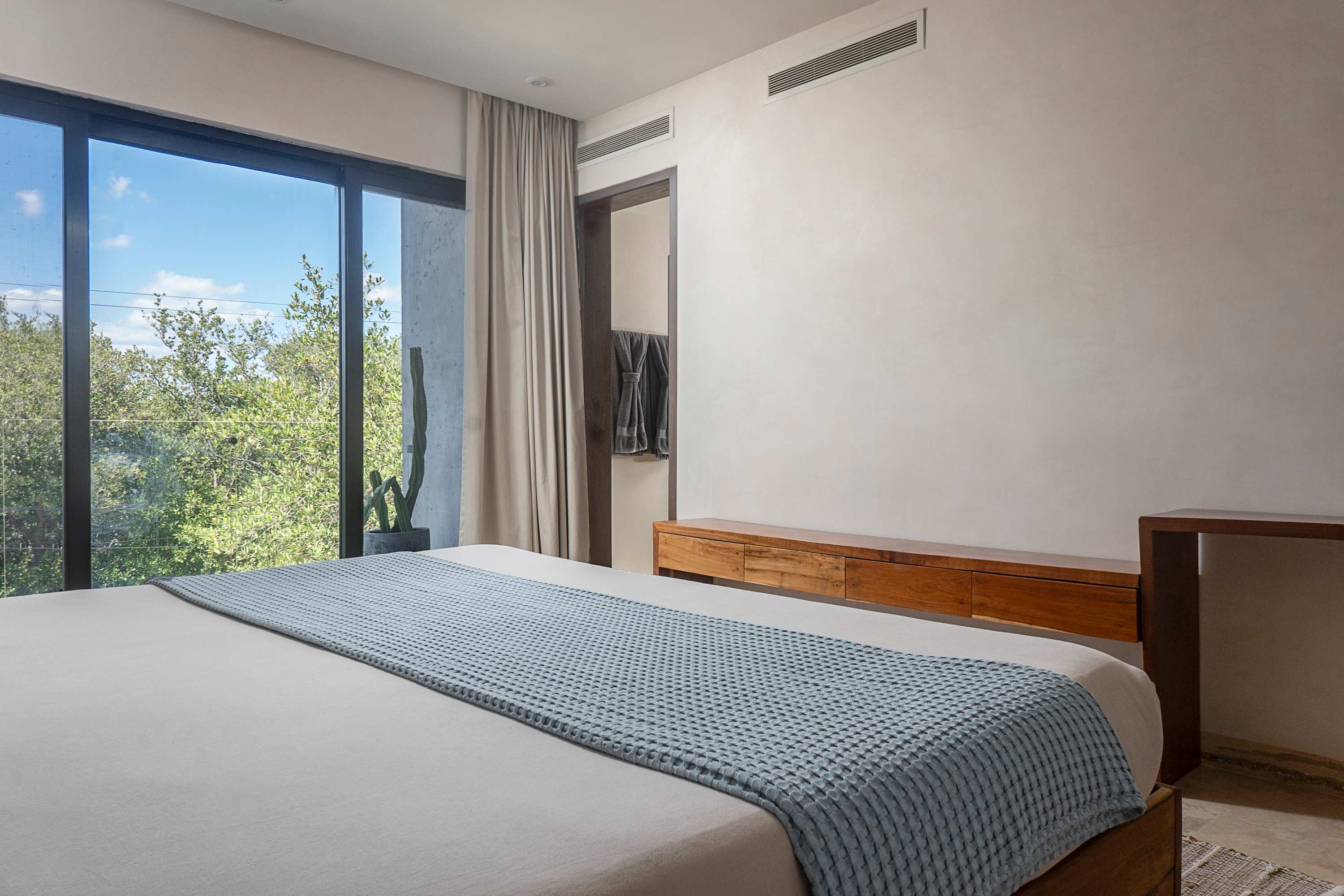 Spacious and comfortable bedroom with a king-size bed