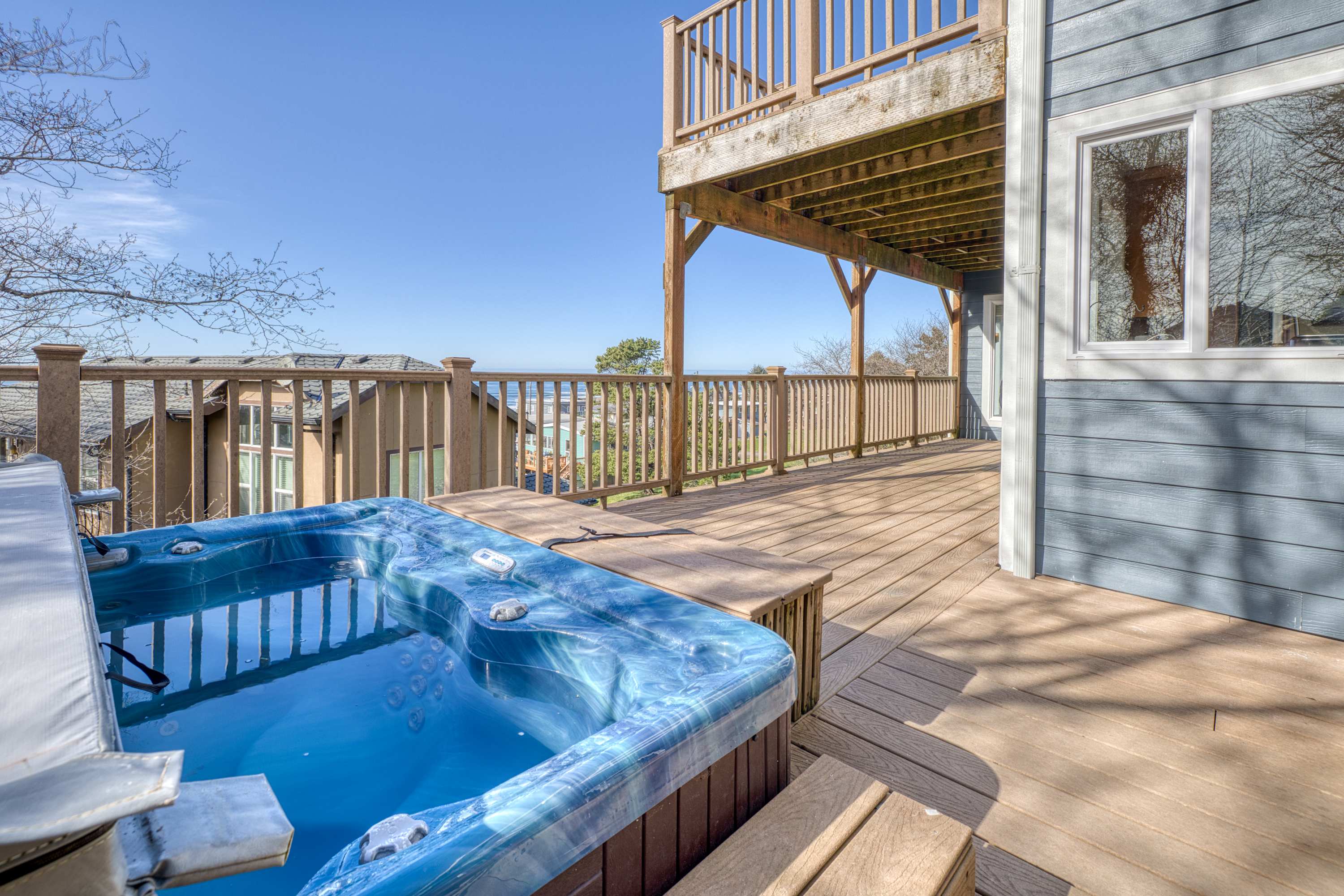 Sunlit home with gorgeous ocean views big decks and hot tub