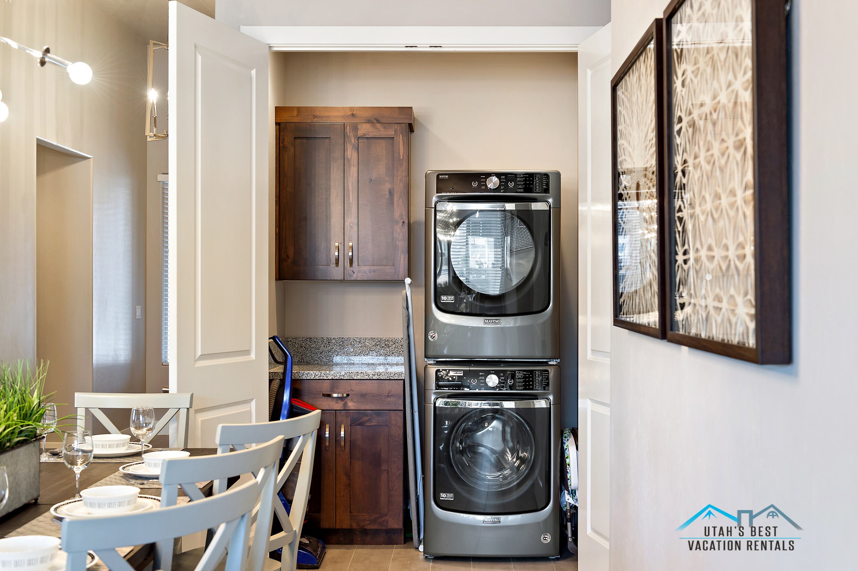 109 - Laundry closet with stacked front-loading washer and dryer
