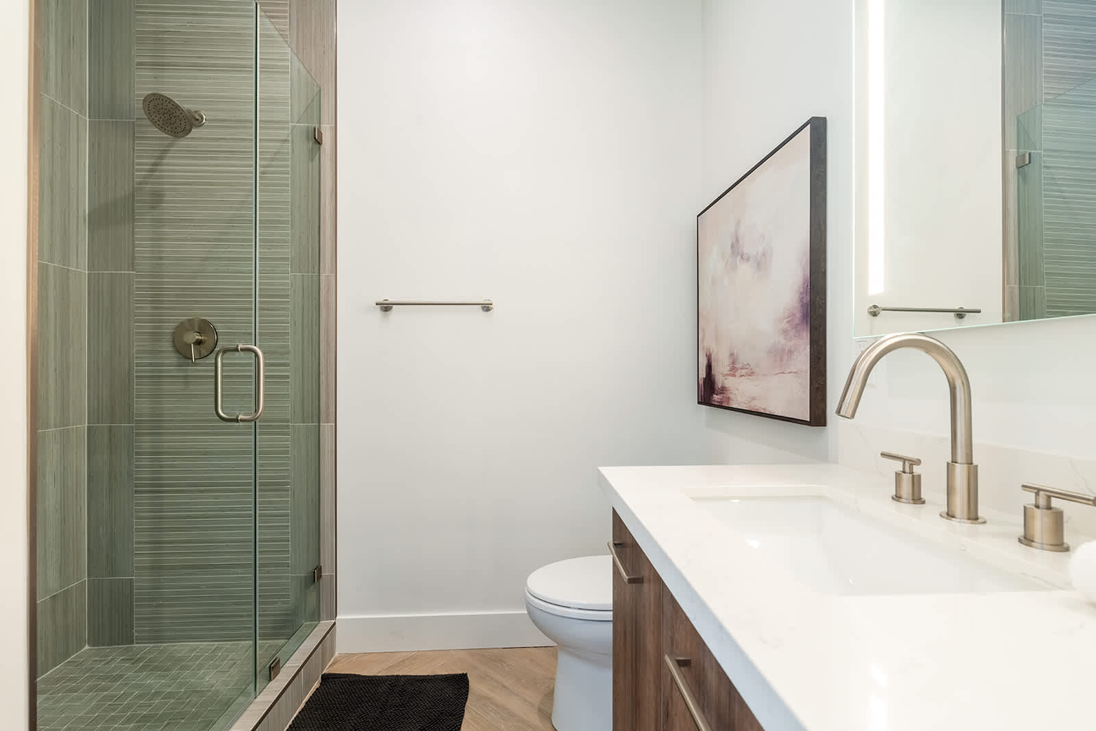 2nd en-suite bathroom with a beautifully designed walk-in shower and a single vanity.