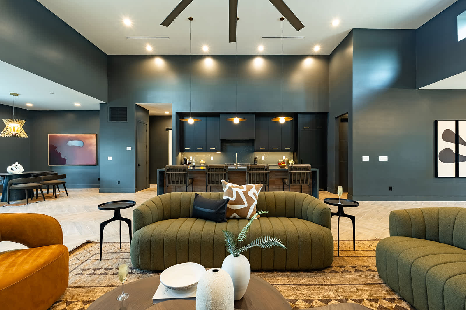 Unwind in this spacious living area with designer furnishings, a large Smart TV, an electric fireplace, and an open layout perfect for relaxation or game day.