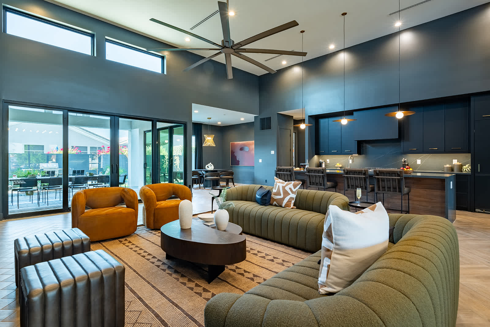 Unwind in this spacious living area with designer furnishings, a large Smart TV, an electric fireplace, and an open layout perfect for relaxation or game day.