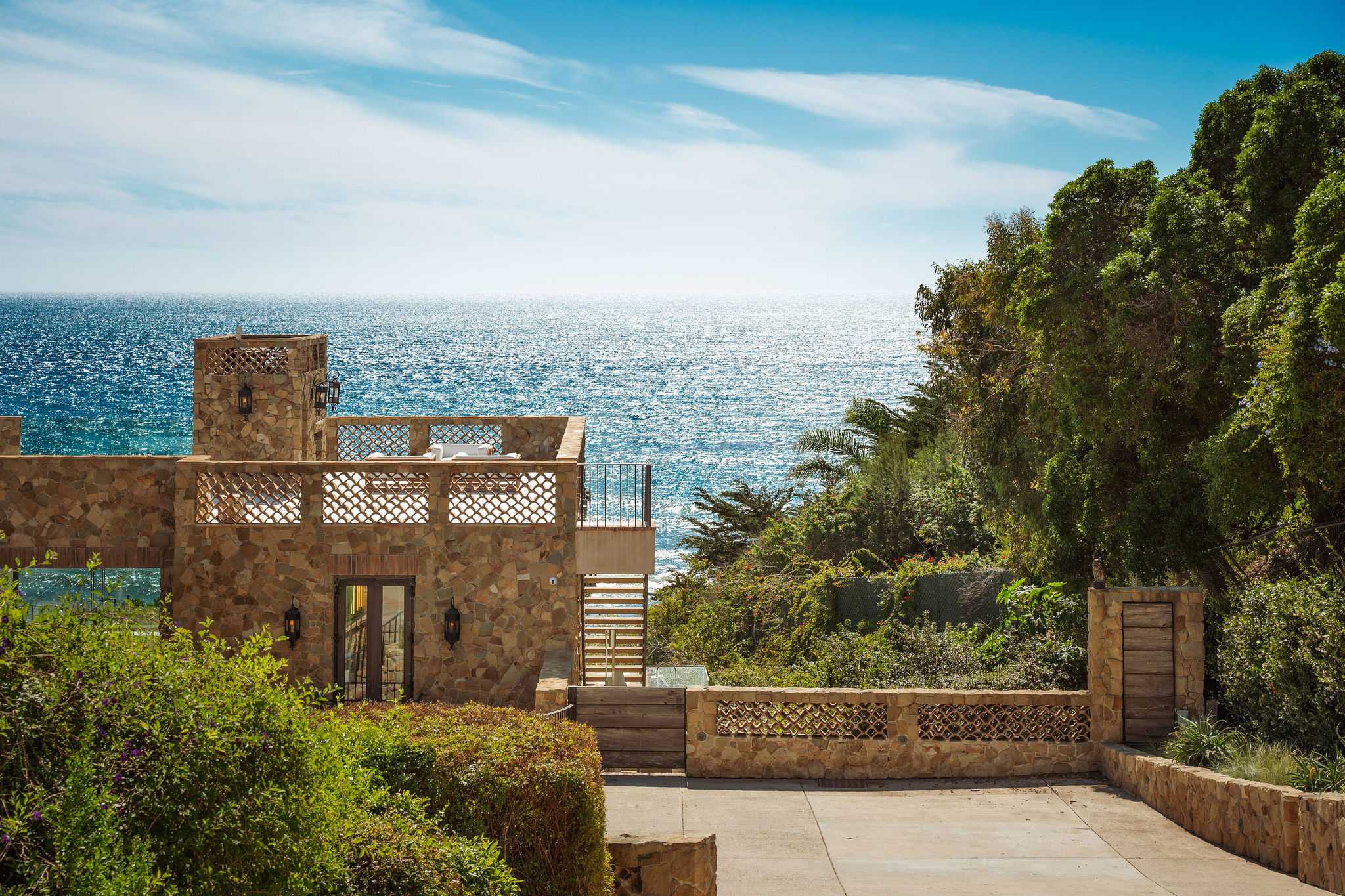 Casa di Pietra sits on a spectacular Malibu oceanfront bluff overlooking the Pacific Ocean.