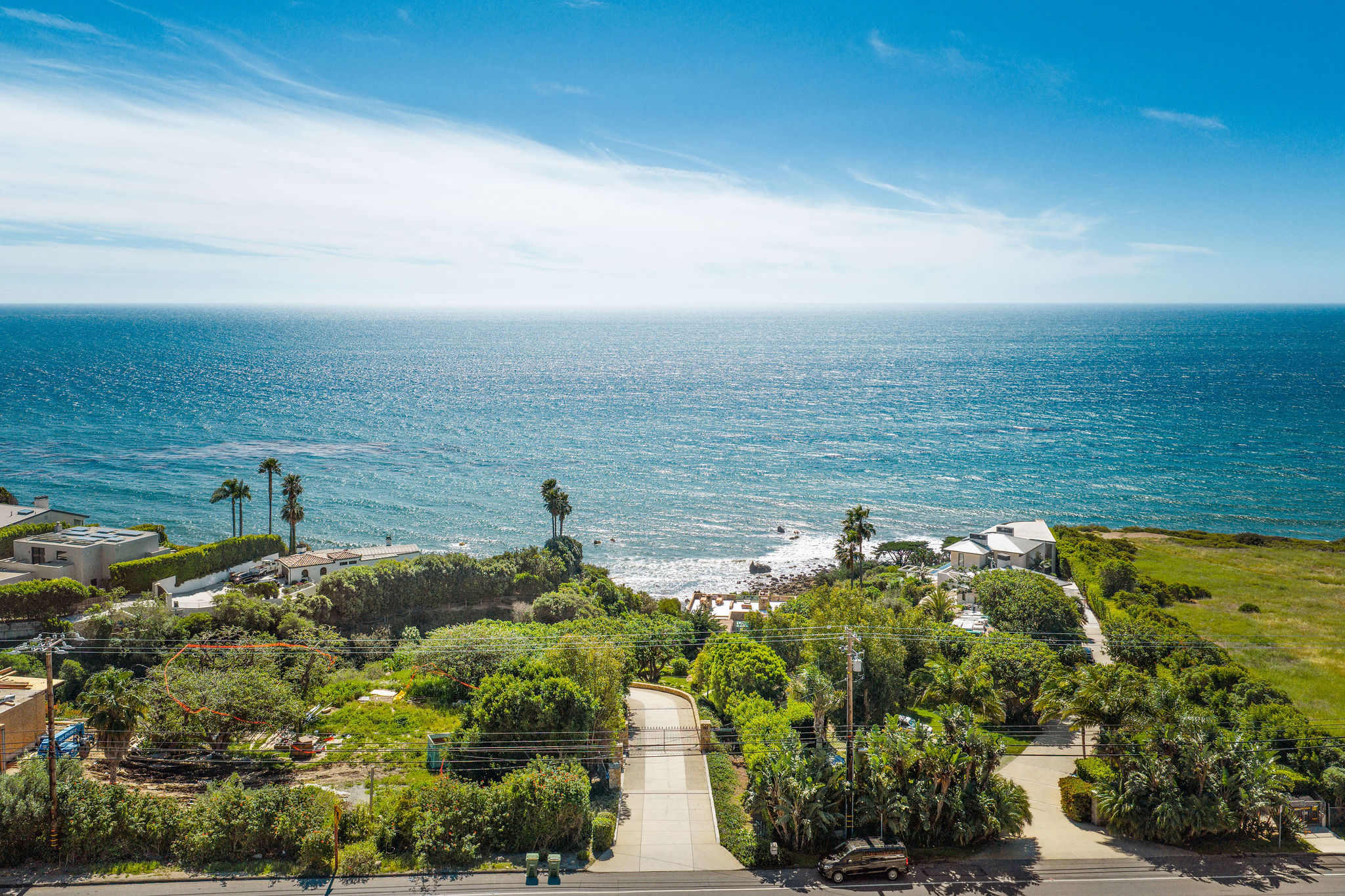 The breathtaking Malibu coastline stretches for miles below.