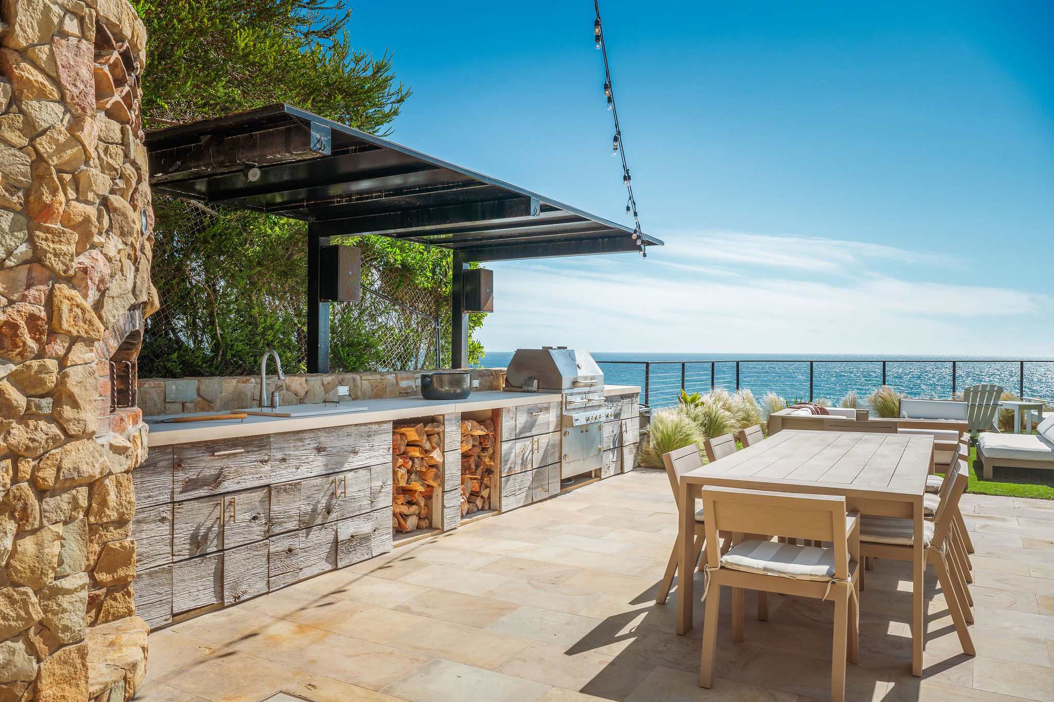Gather on the rooftop deck overlooking Malibu’s coastline.