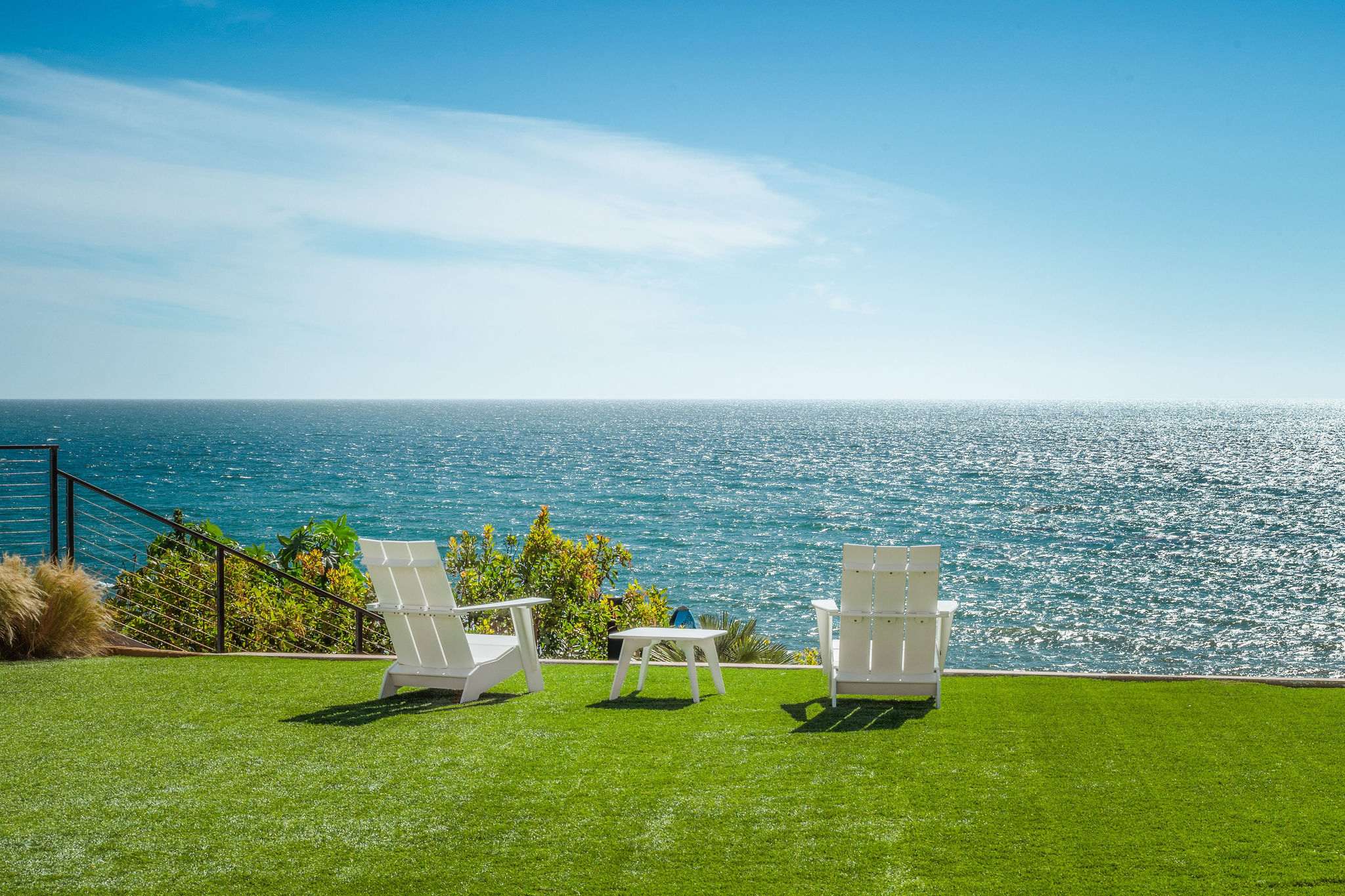 Watch surfers and dolphins from this Malibu blufftop vacation home.