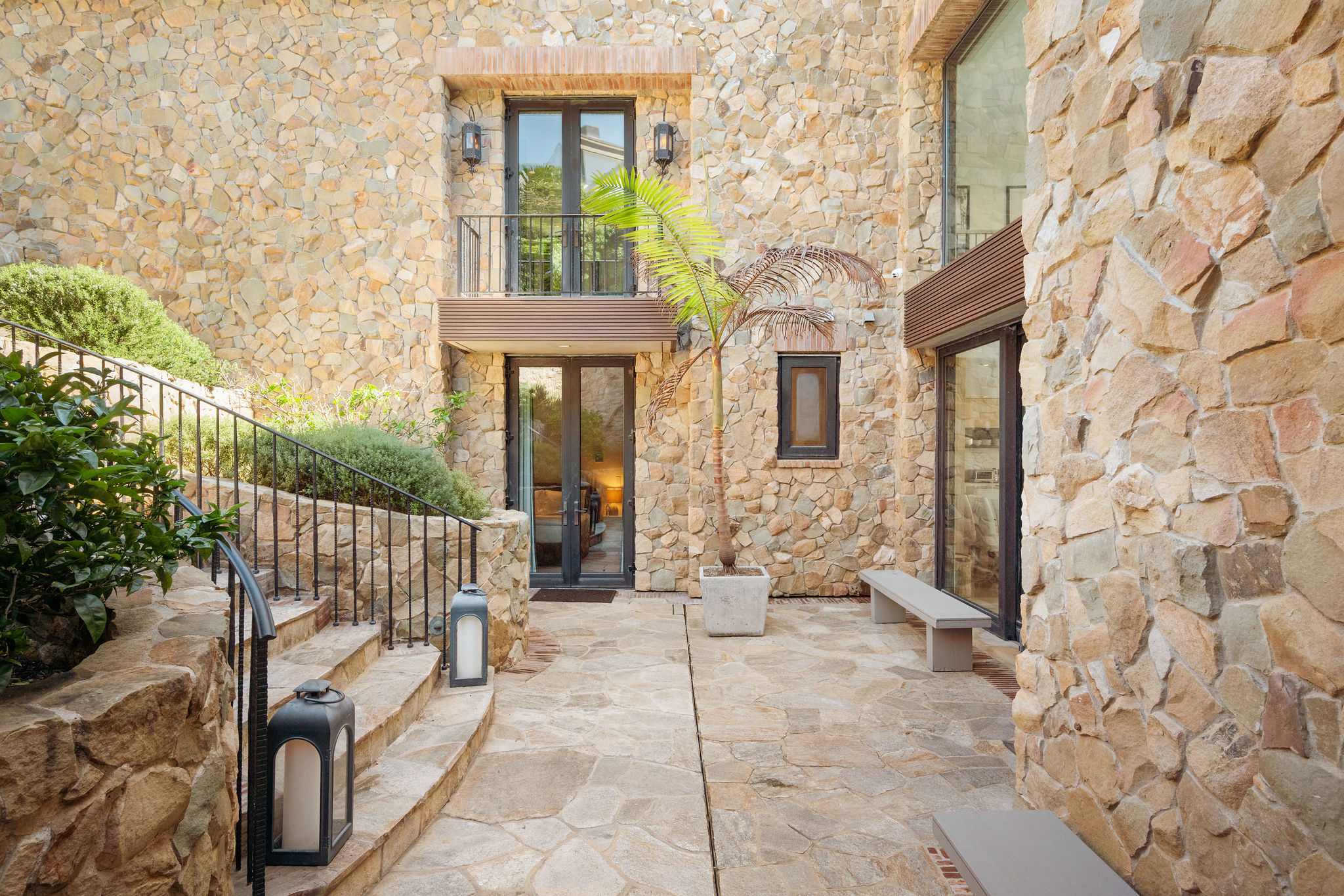 The dramatic stone architecture of Casa di Pietra Malibu.