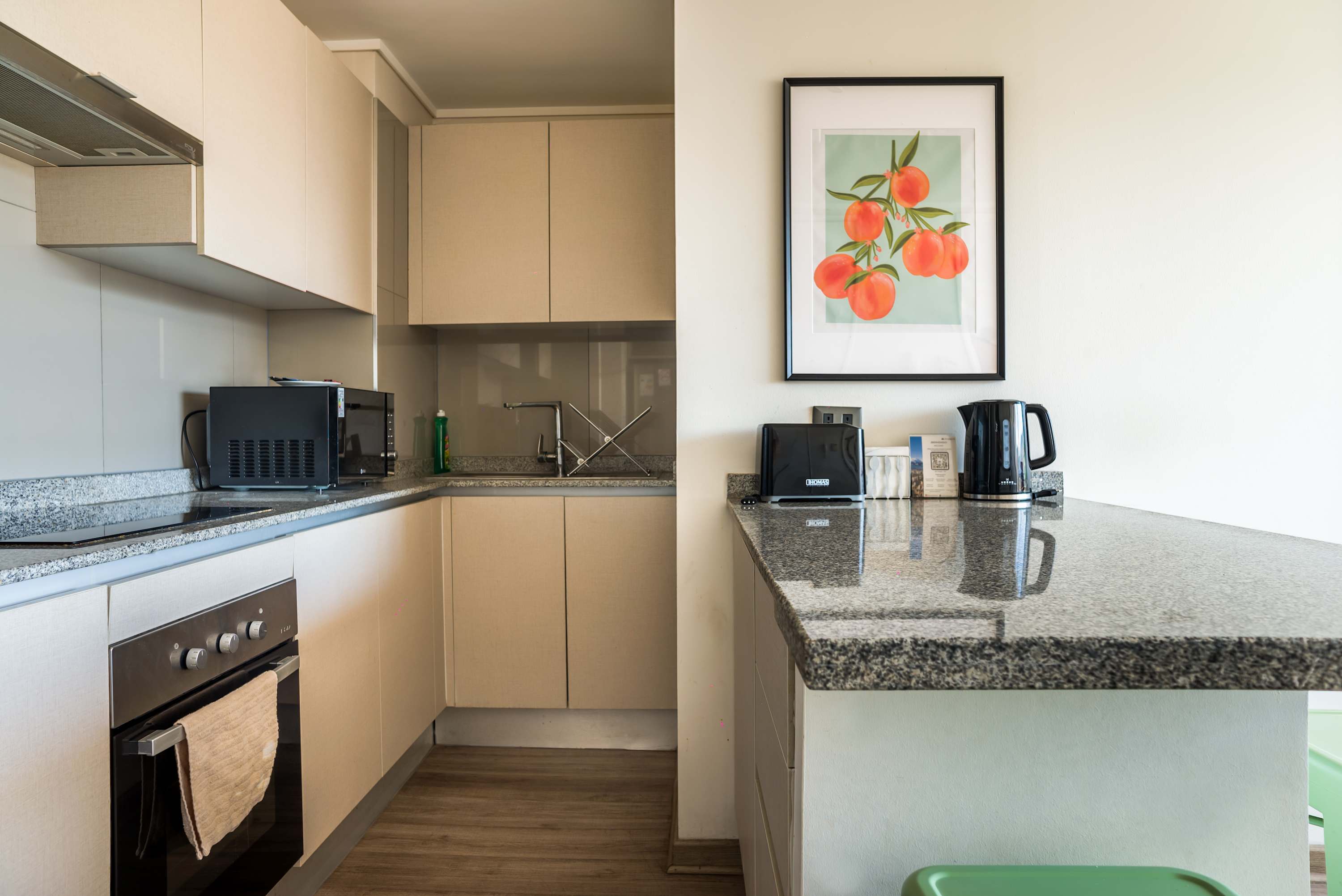 Sleek and modern kitchen with all essentials for a comfortable stay.