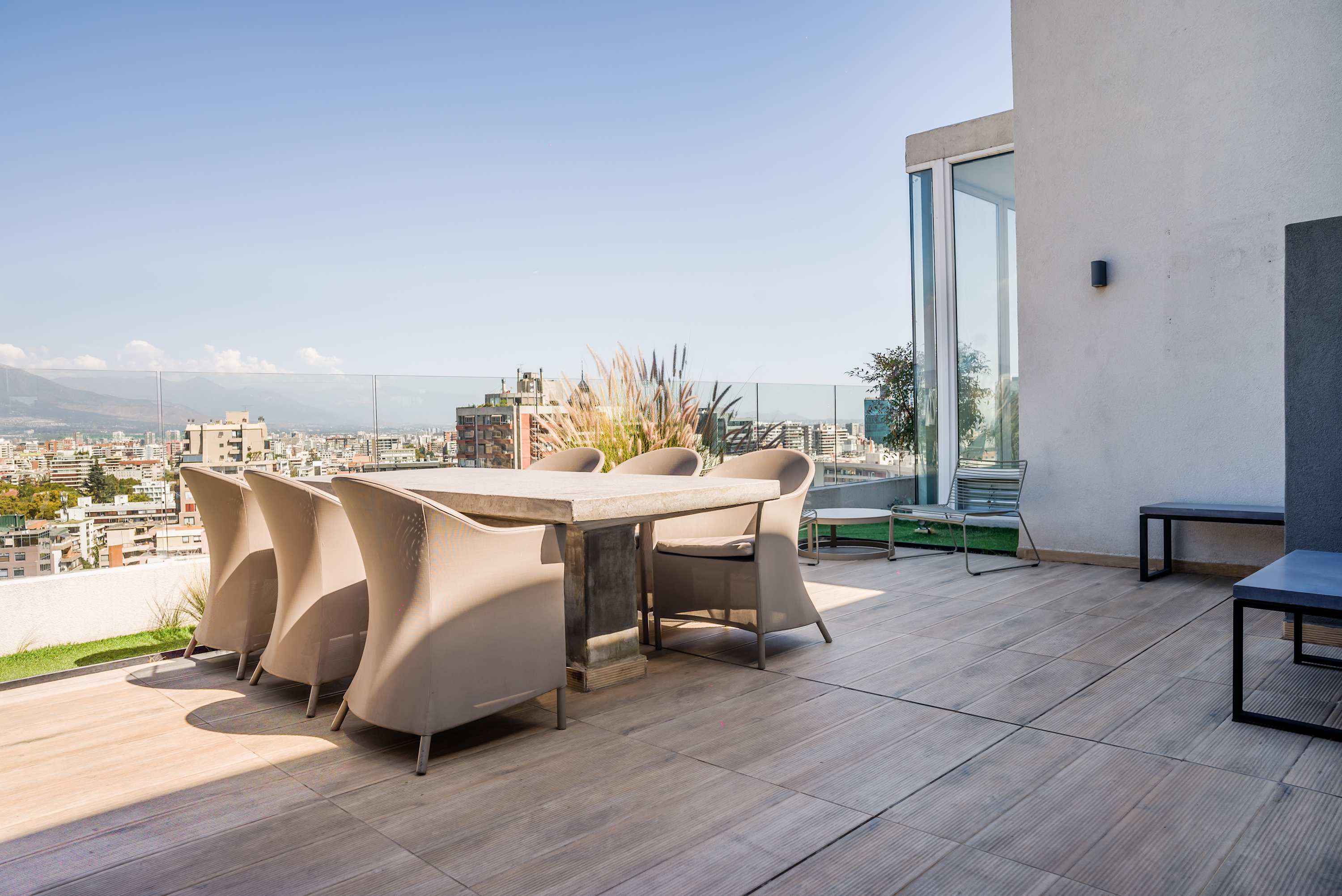 Enjoy breathtaking city views from this stylish terrace, perfect for dining and relaxation.