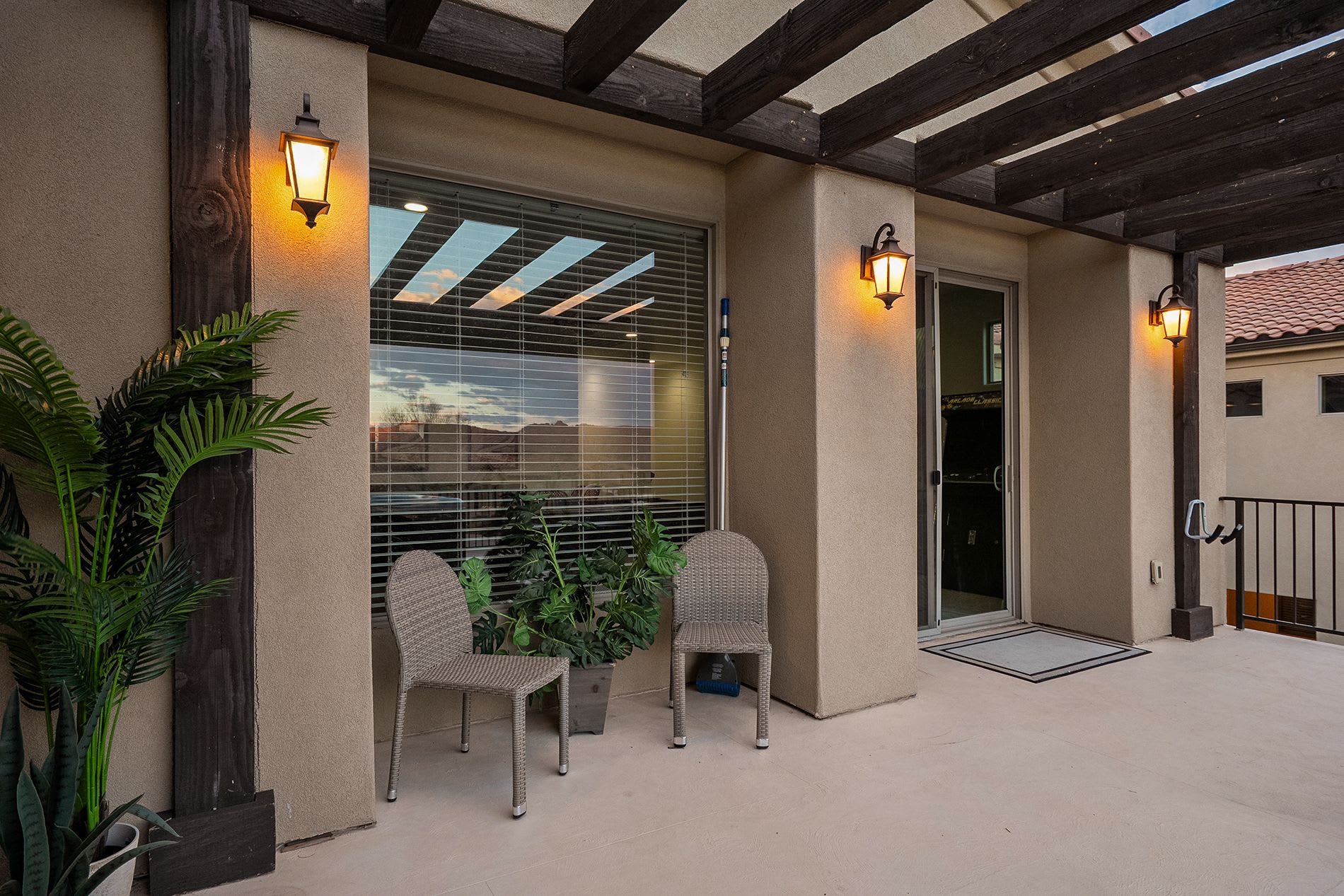 Shaded outdoor patio entry with welcoming seating area