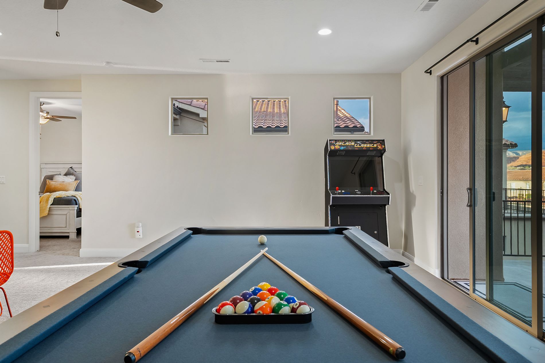 Game room with large sliding doors and patio access