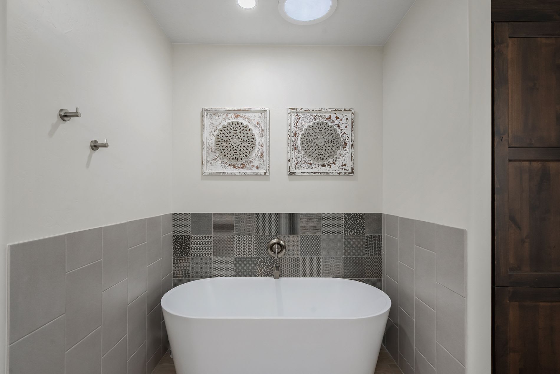 Luxurious soaking tub with modern tile accents