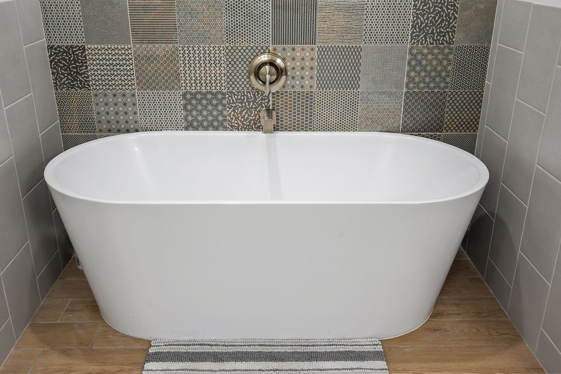 Freestanding bathtub and tiled walk-in shower