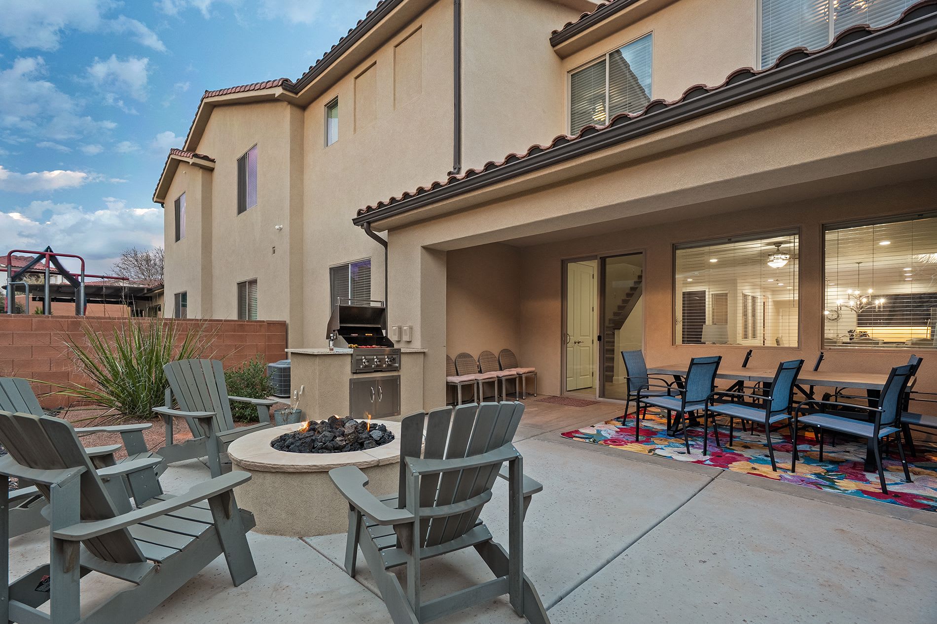 Large backyard patio ideal for gatherings and evening fires