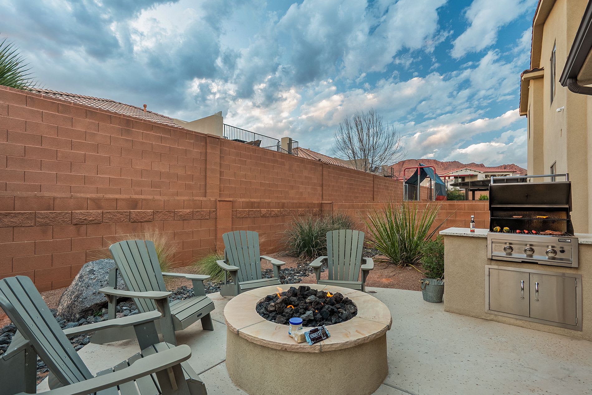 Outdoor lounge area with fire pit and comfortable seating