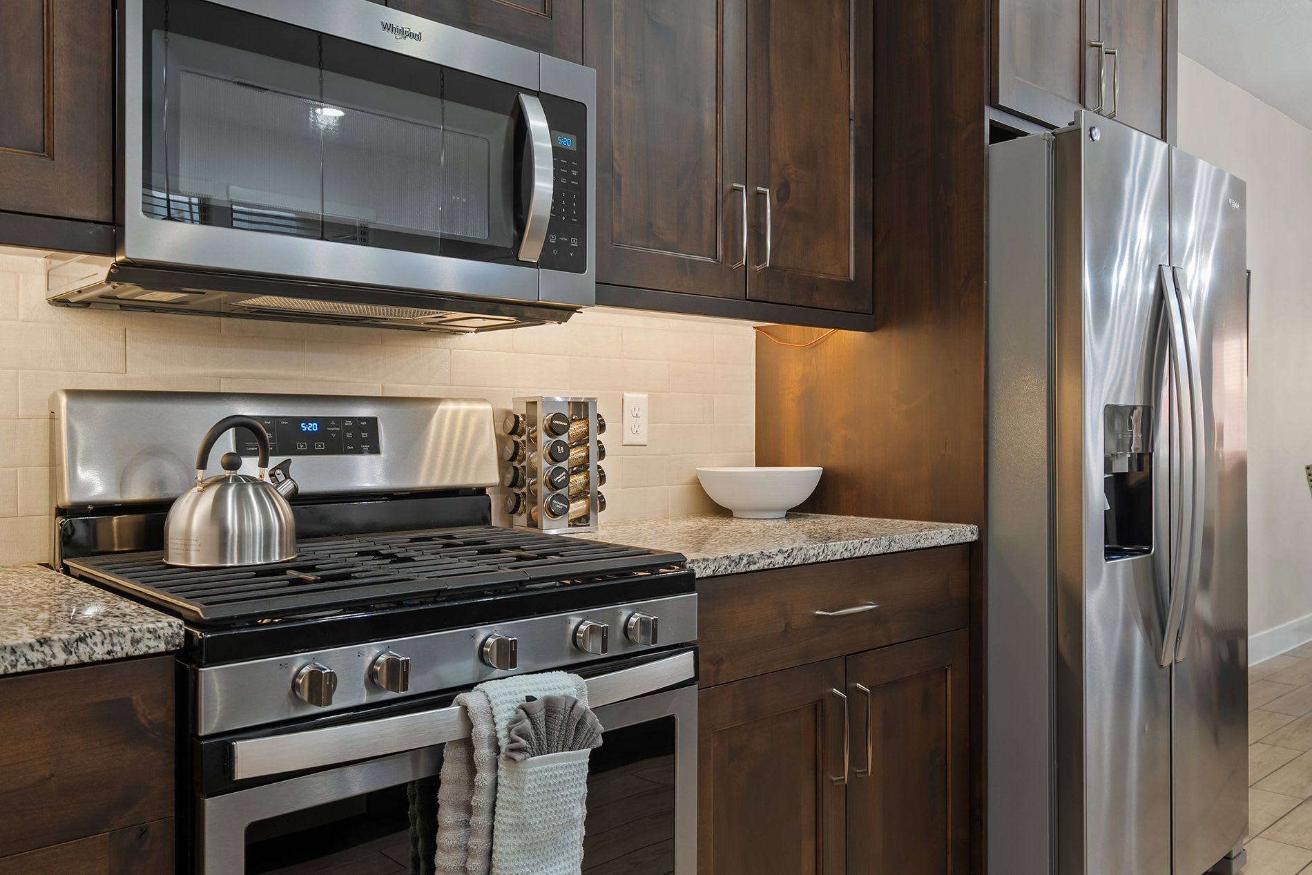 Modern kitchen with stainless appliances and large island