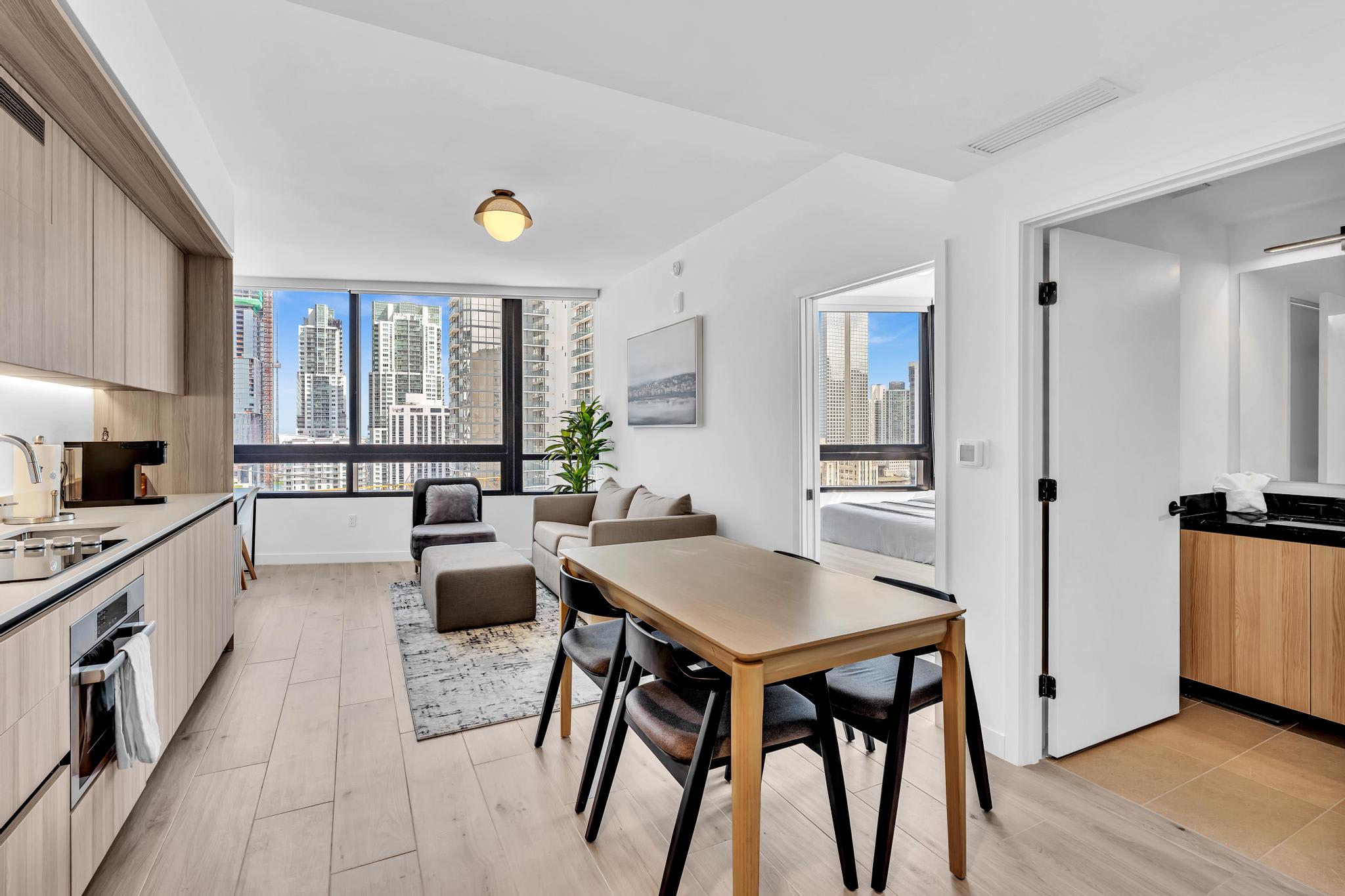 Chic studio with modern kitchen and breathtaking city views, perfect for urban living.