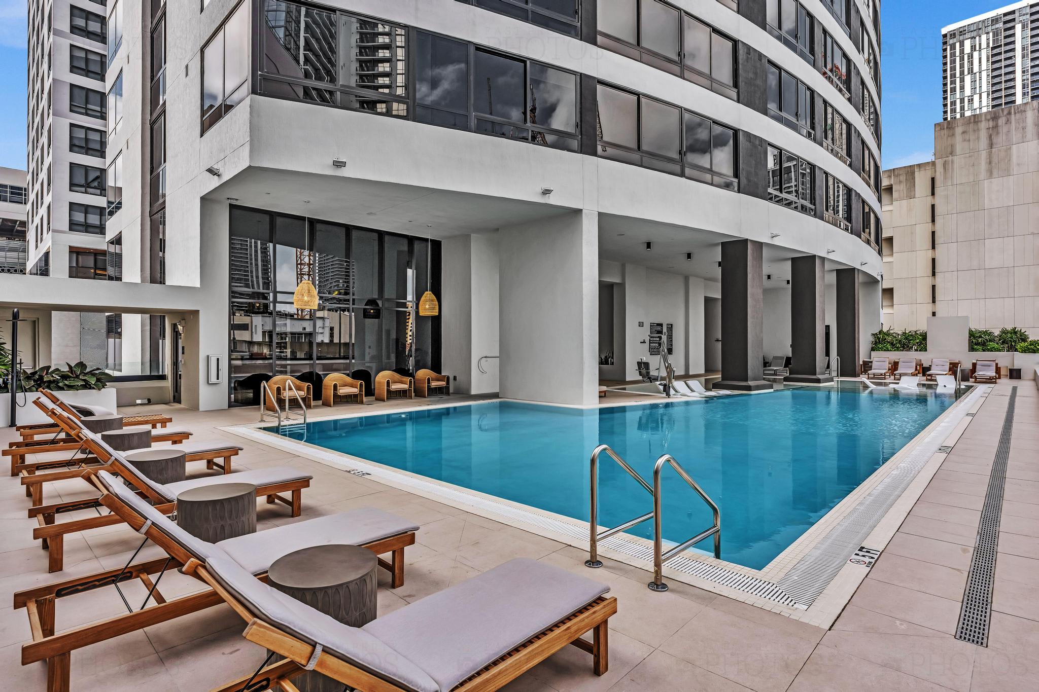 Relax by the stunning rooftop pool with city views and modern amenities, perfect for unwinding after a day of exploring.