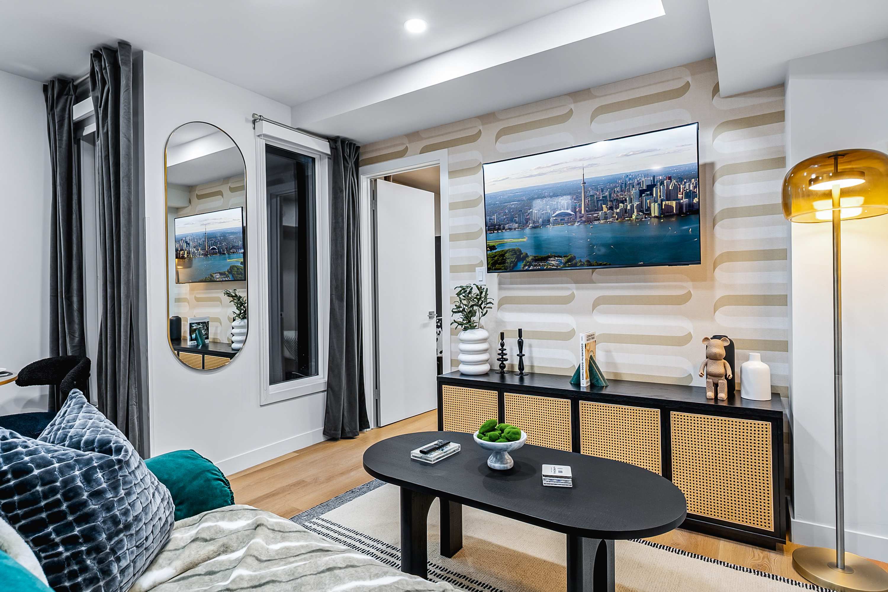 Bright & stylish living room with a comfortable sofa bed and smart TV.