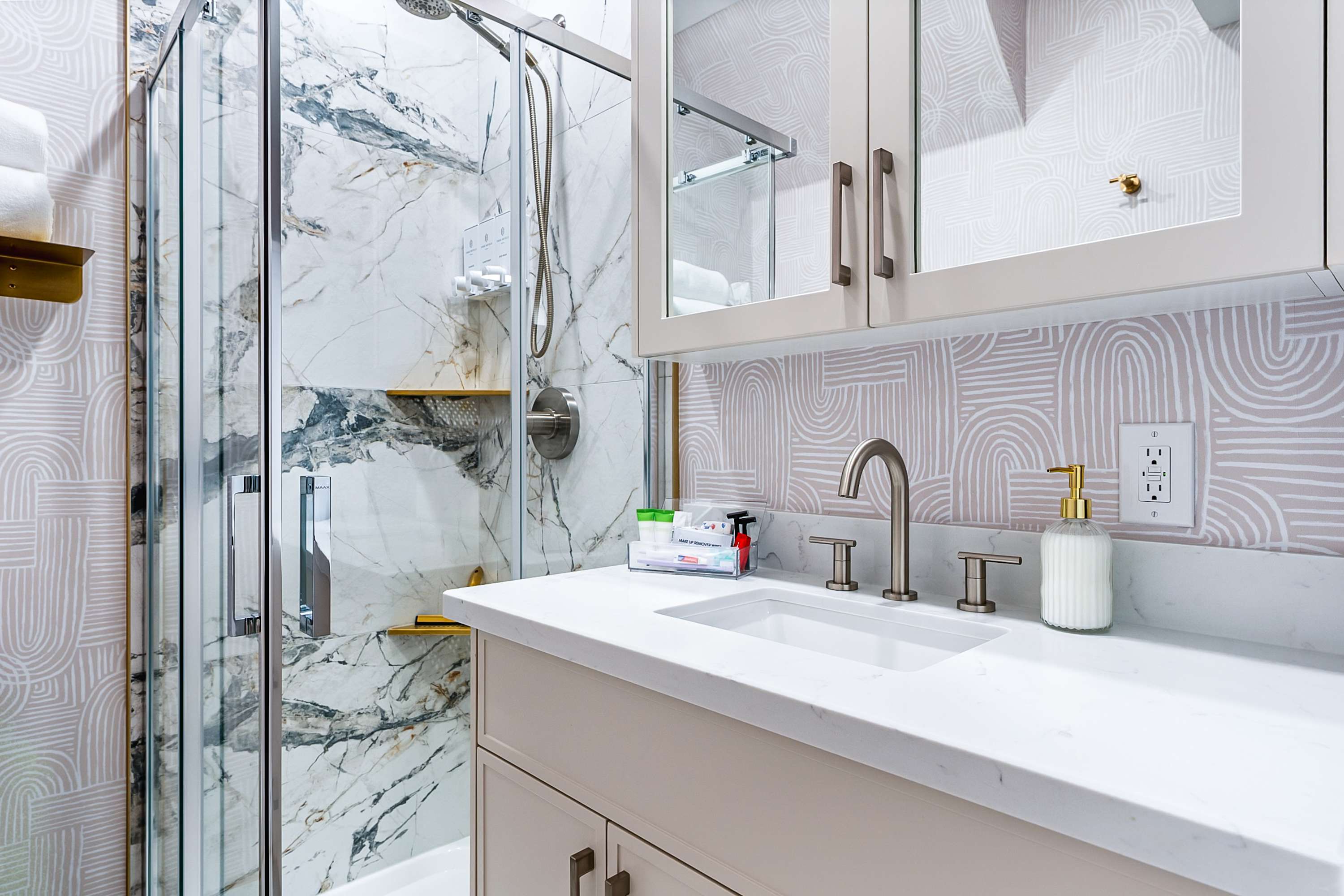 Fresh, modern bathroom with a walk-in glass shower.