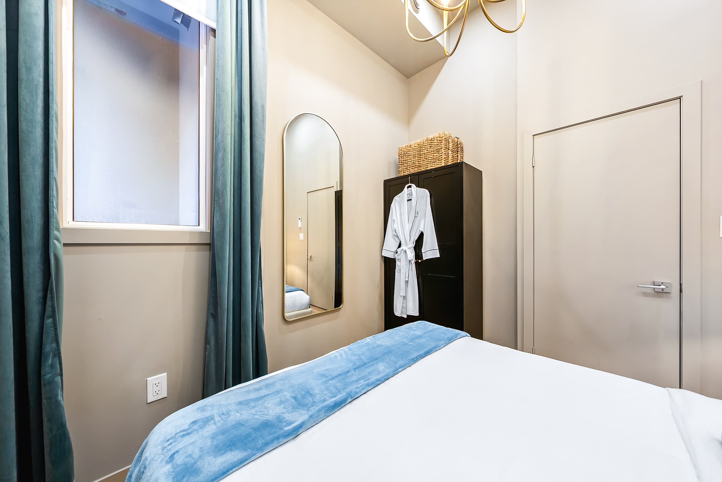 Bright and comfortable bedroom with practical storage.