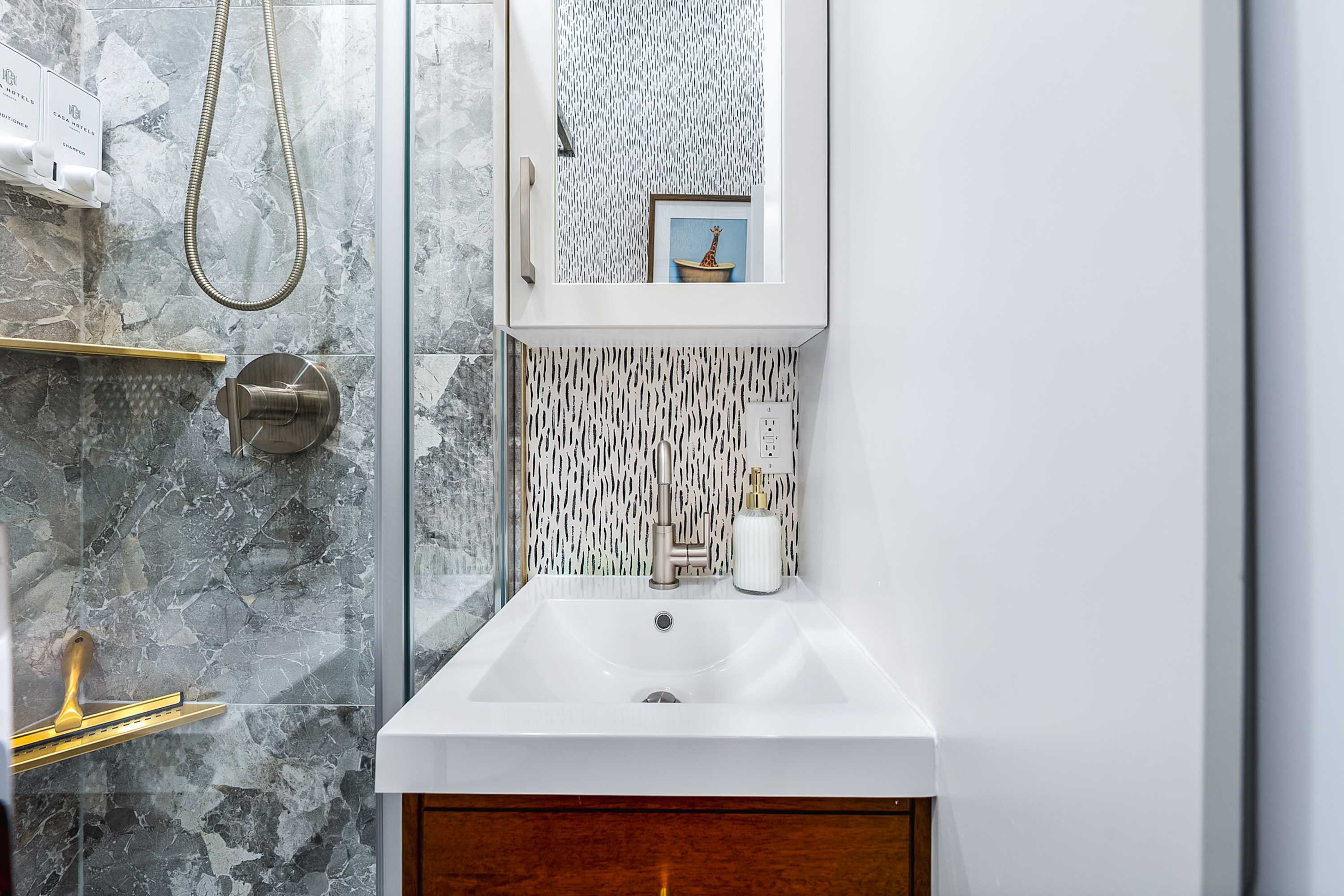 Fresh, modern bathroom with a walk-in glass shower.