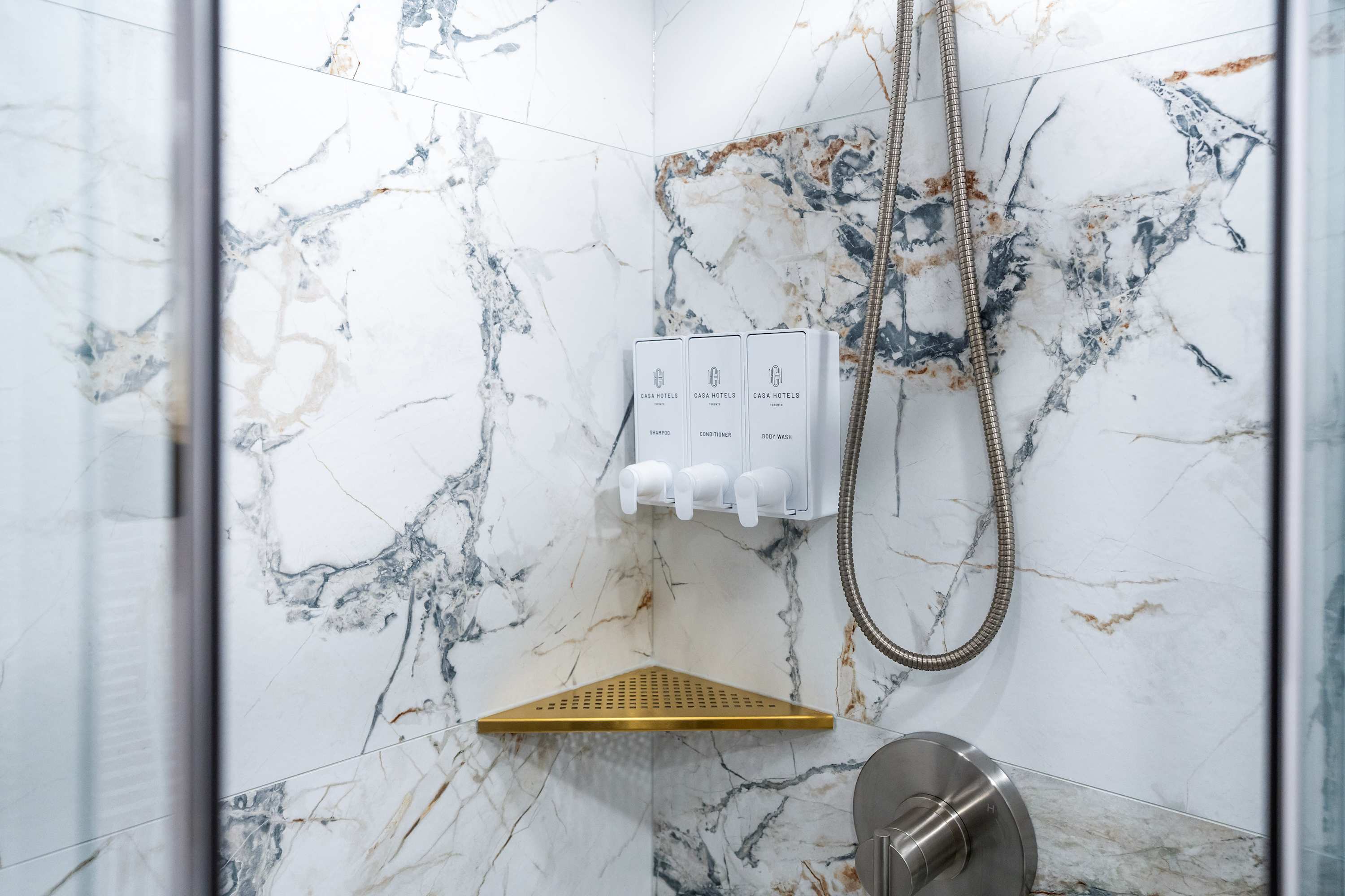 Modern bathroom with a walk-in glass shower.