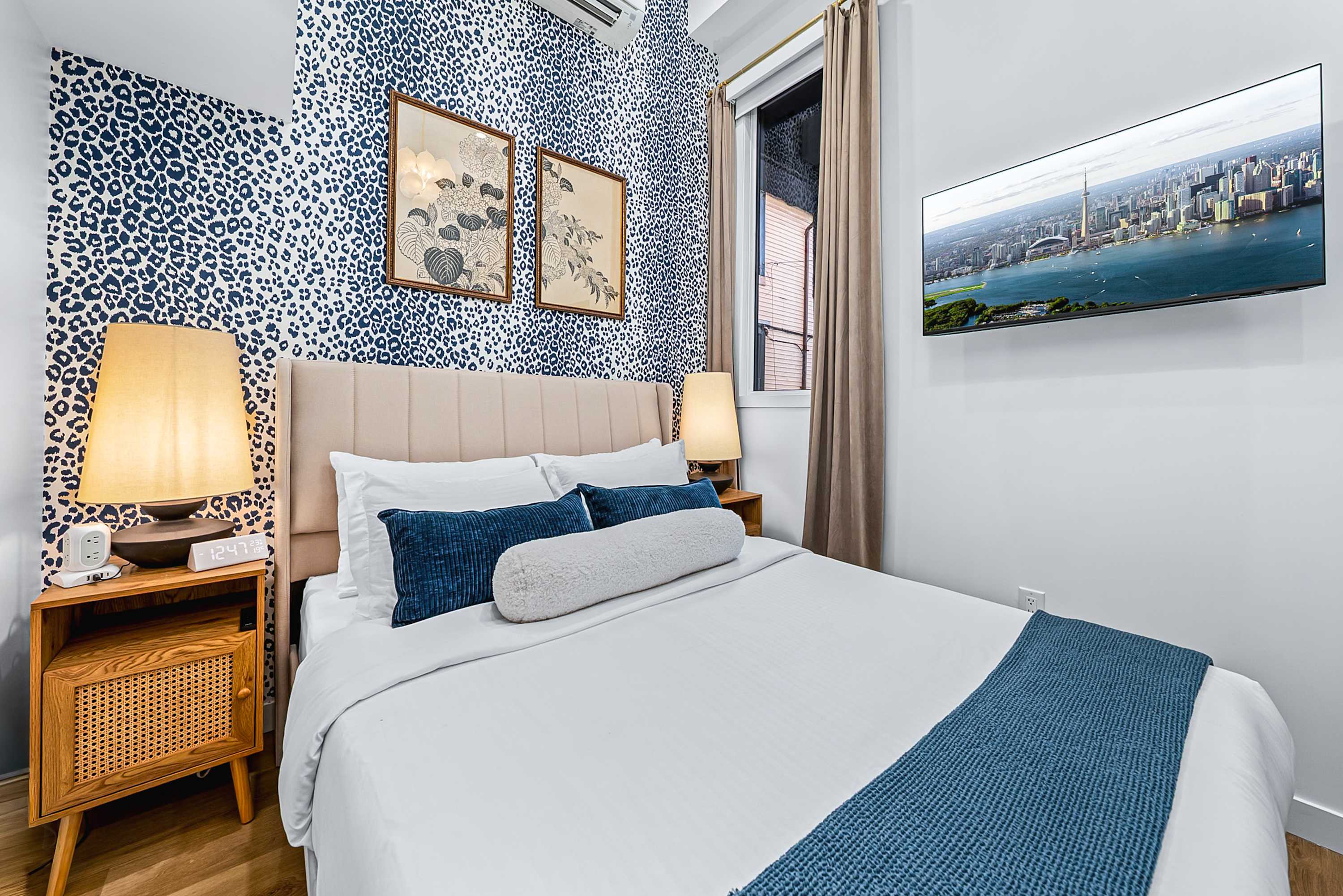 Wake up refreshed in this serene, beautifully finished bedroom with a queen bed and smart TV.