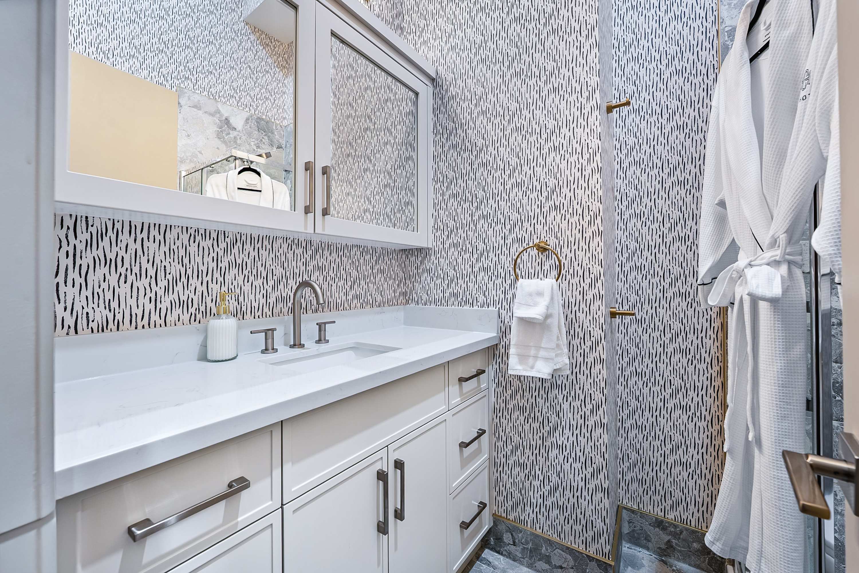 A modern, spa-inspired bathroom with sleek finishes and a walk-in shower.