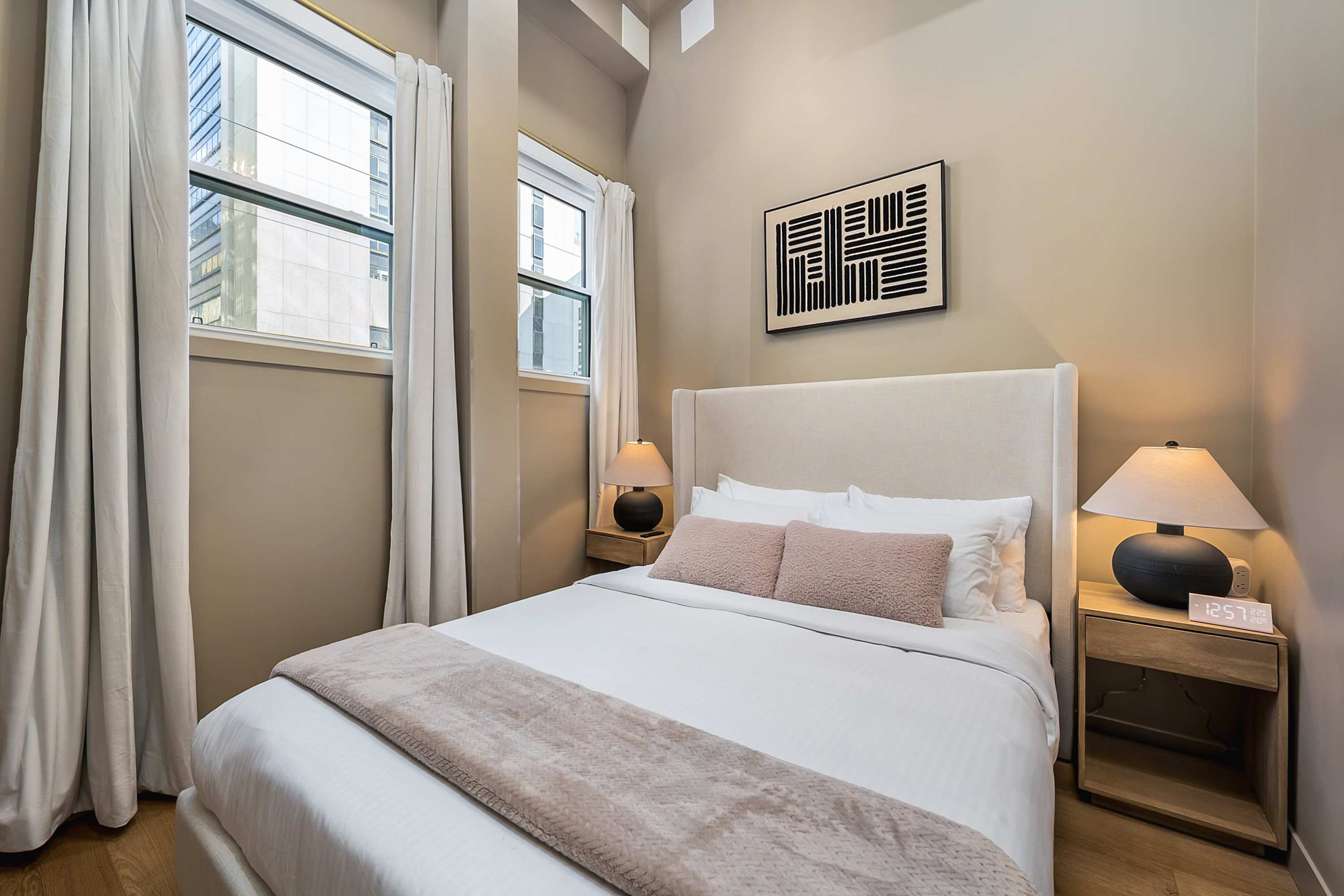 Beautiful second bedroom with soft lighting.