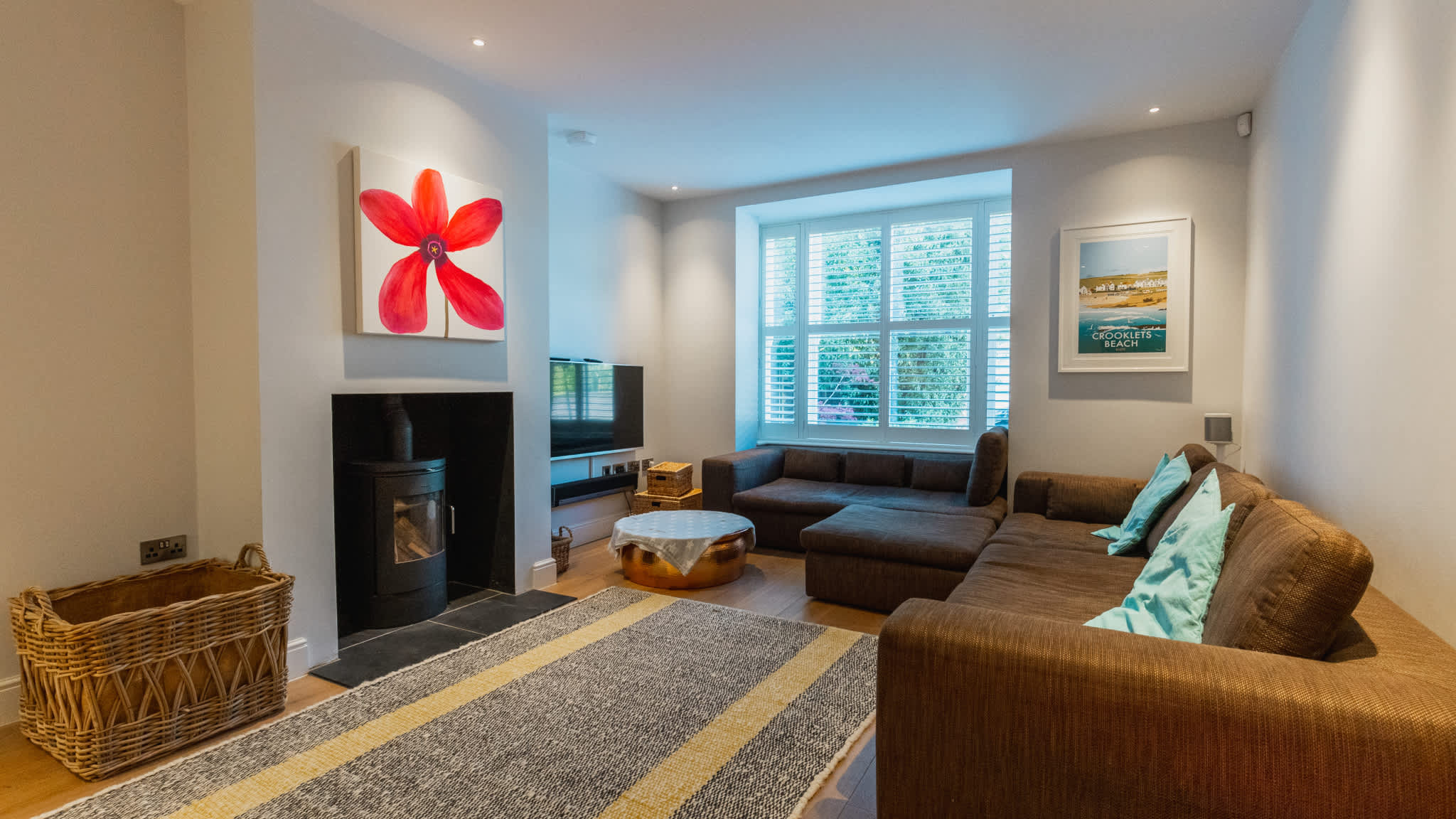 Sink into comfy seating and unwind in the separate lounge with log burner.