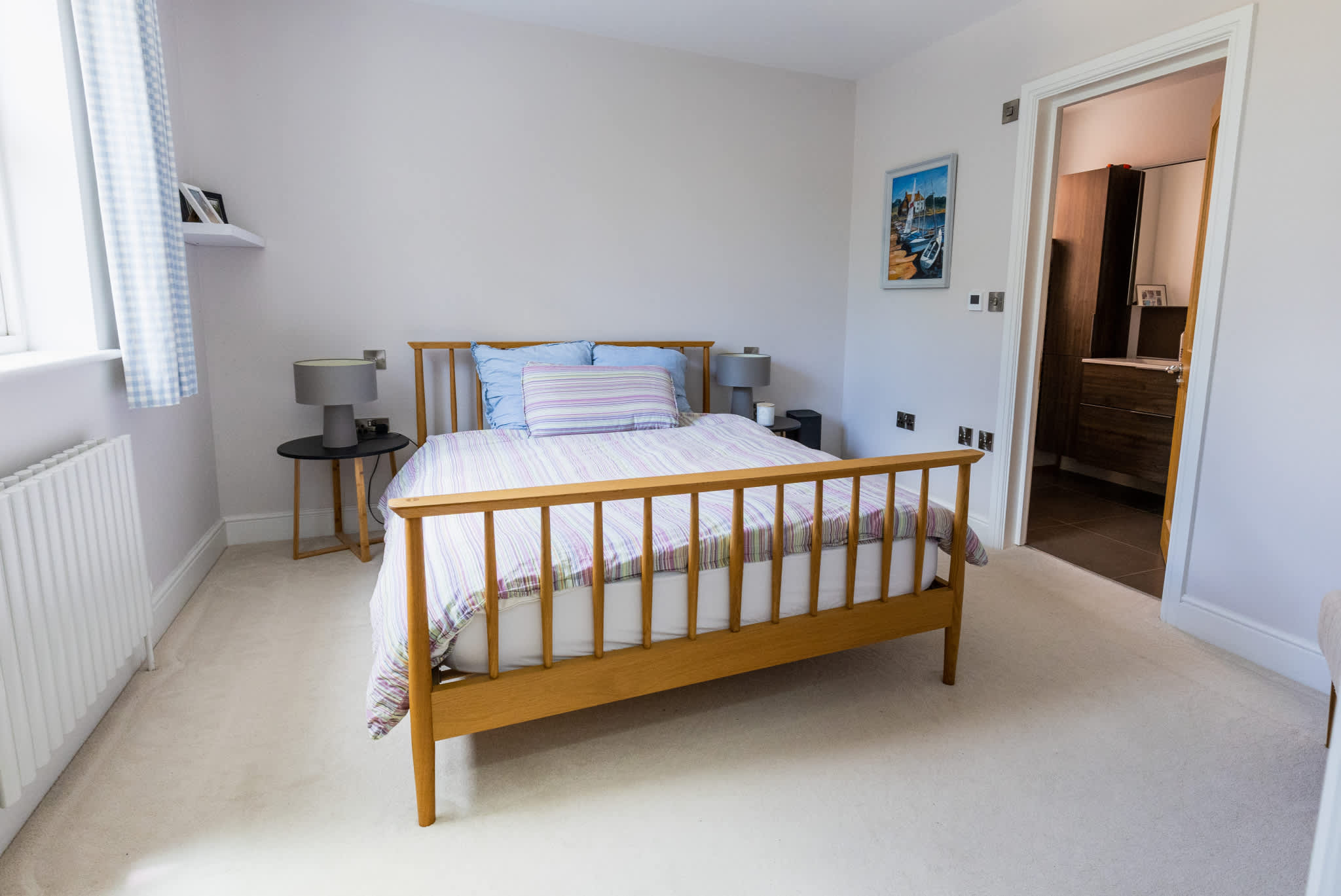 Bright double bedroom with garden views and comfortable bedding for a restful stay.