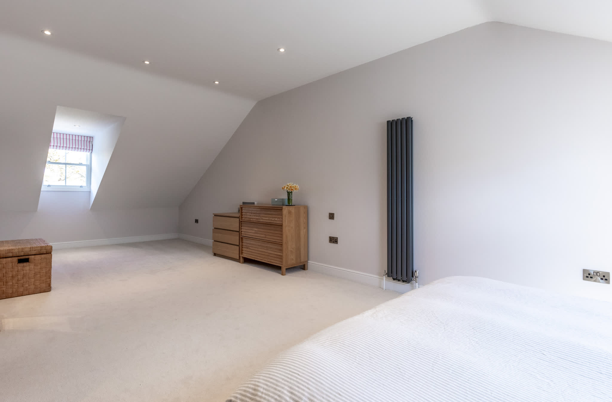 Spacious loft bedroom with vaulted ceilings, skylight and plenty of room to relax.