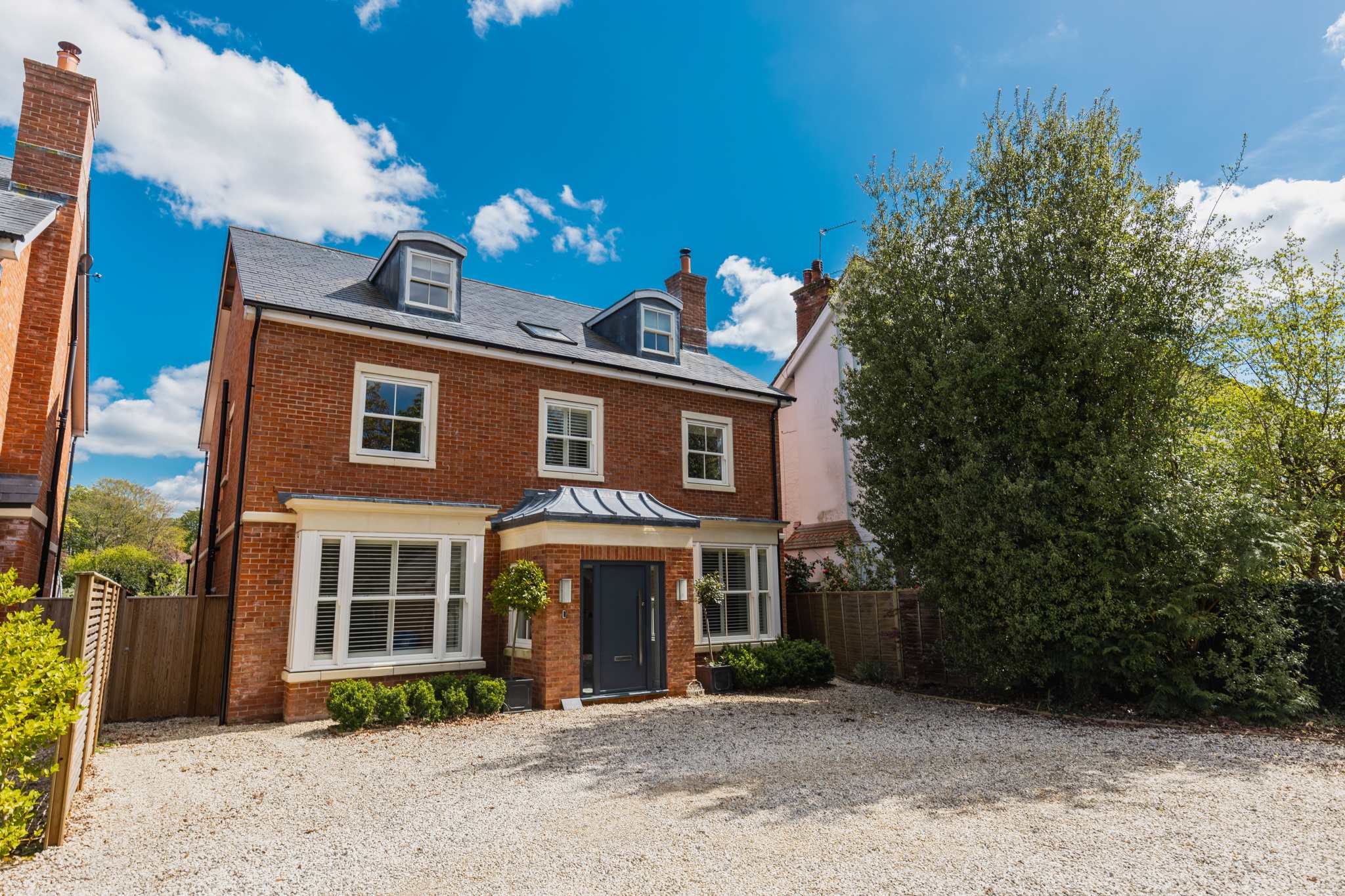 Impressive detached 6-bedroom home with private driveway parking for up to five cars.