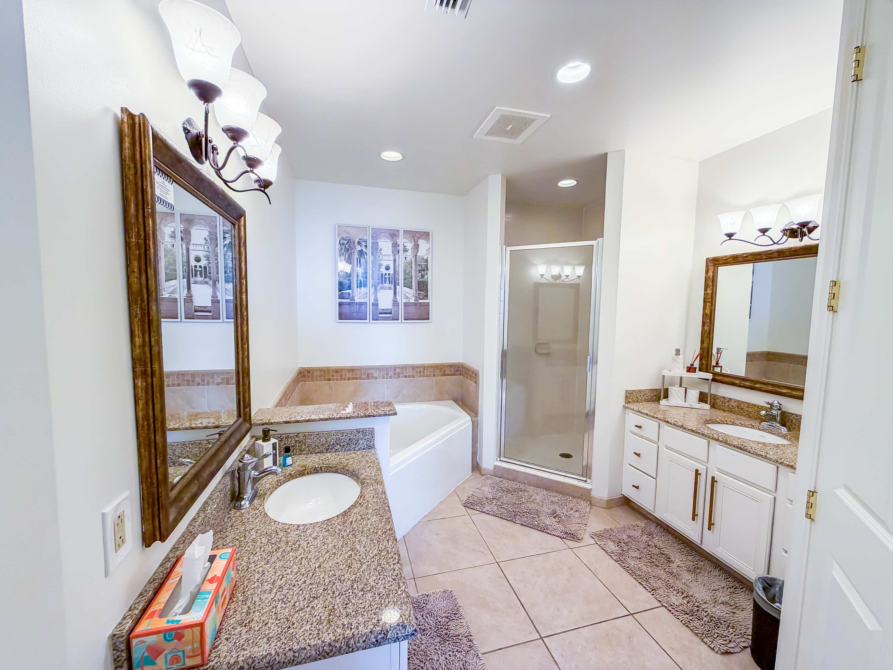 Marriott 3707 – Spacious bathroom with double sinks, large soaking tub, walk-in shower, and decorative mirrors.