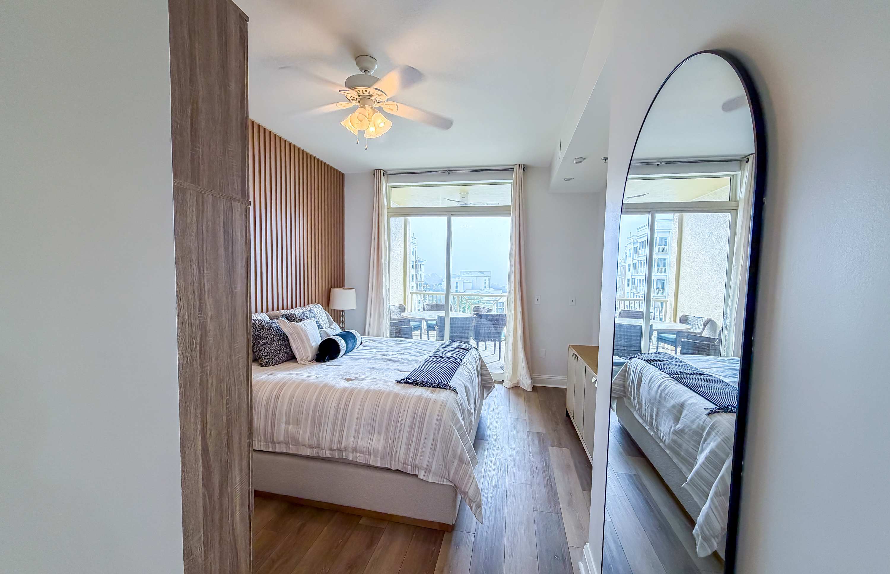 Marriott 3707 – Cozy bedroom with a king bed, large window, and balcony view.