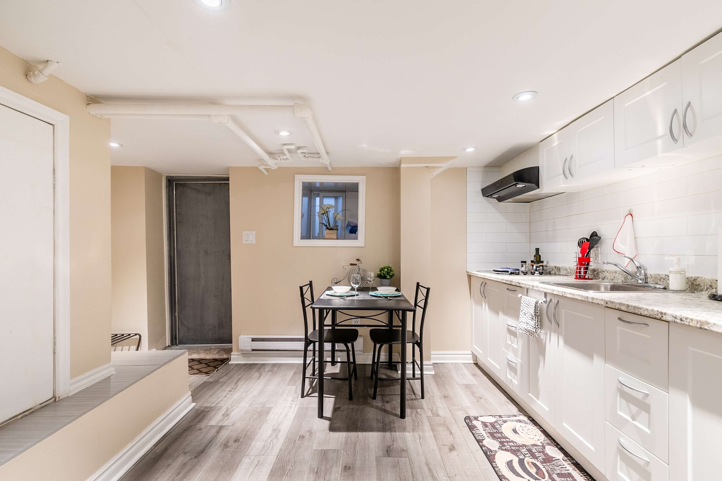 Dining table for two with easy access to the kitchen for quick meals.