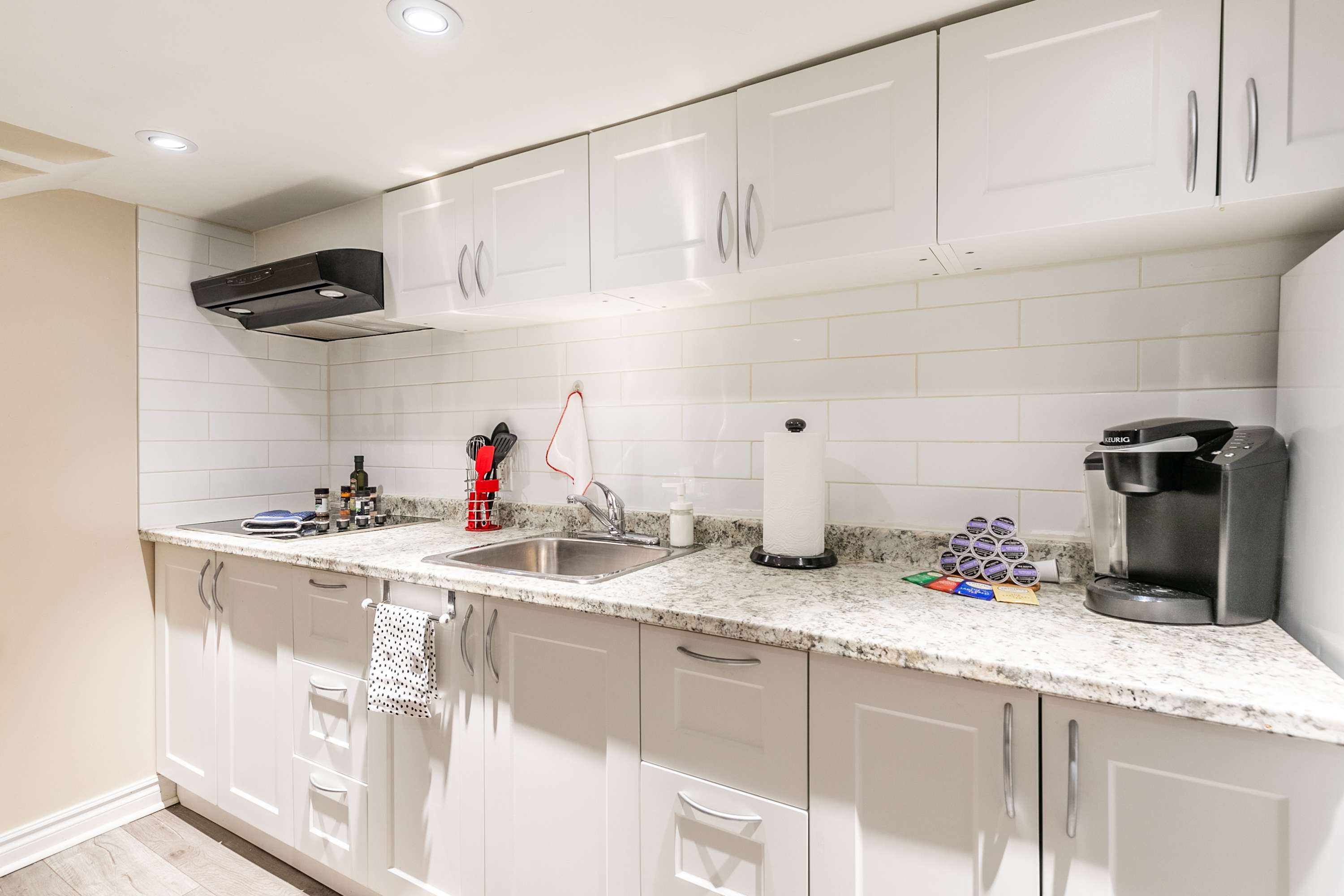 Full kitchen with open workspace and coffee machine, perfect for preparing breakfast, lunch, or dinner.