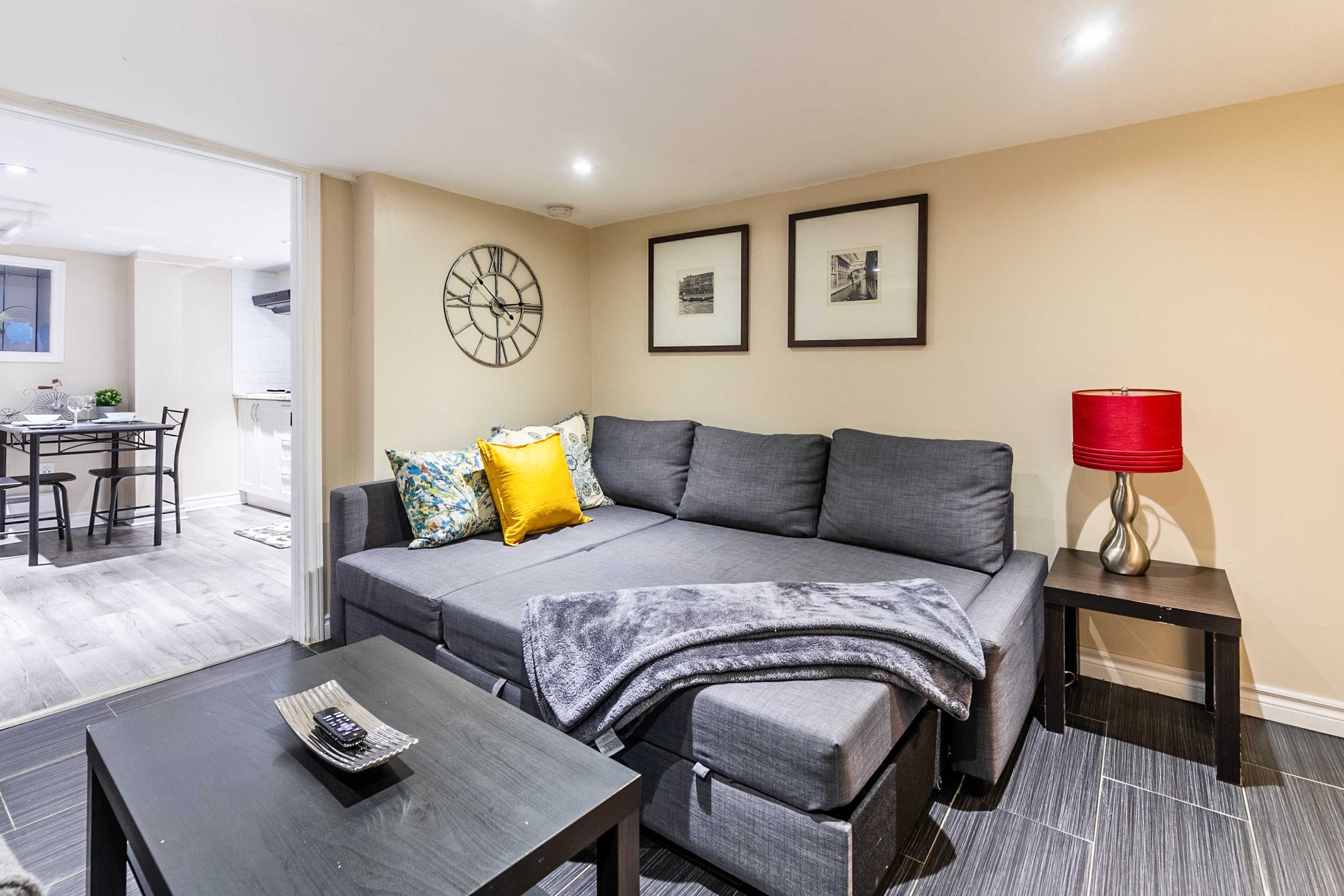 Convertible sofa bed with center table, providing extra sleeping space and a comfortable lounging area.