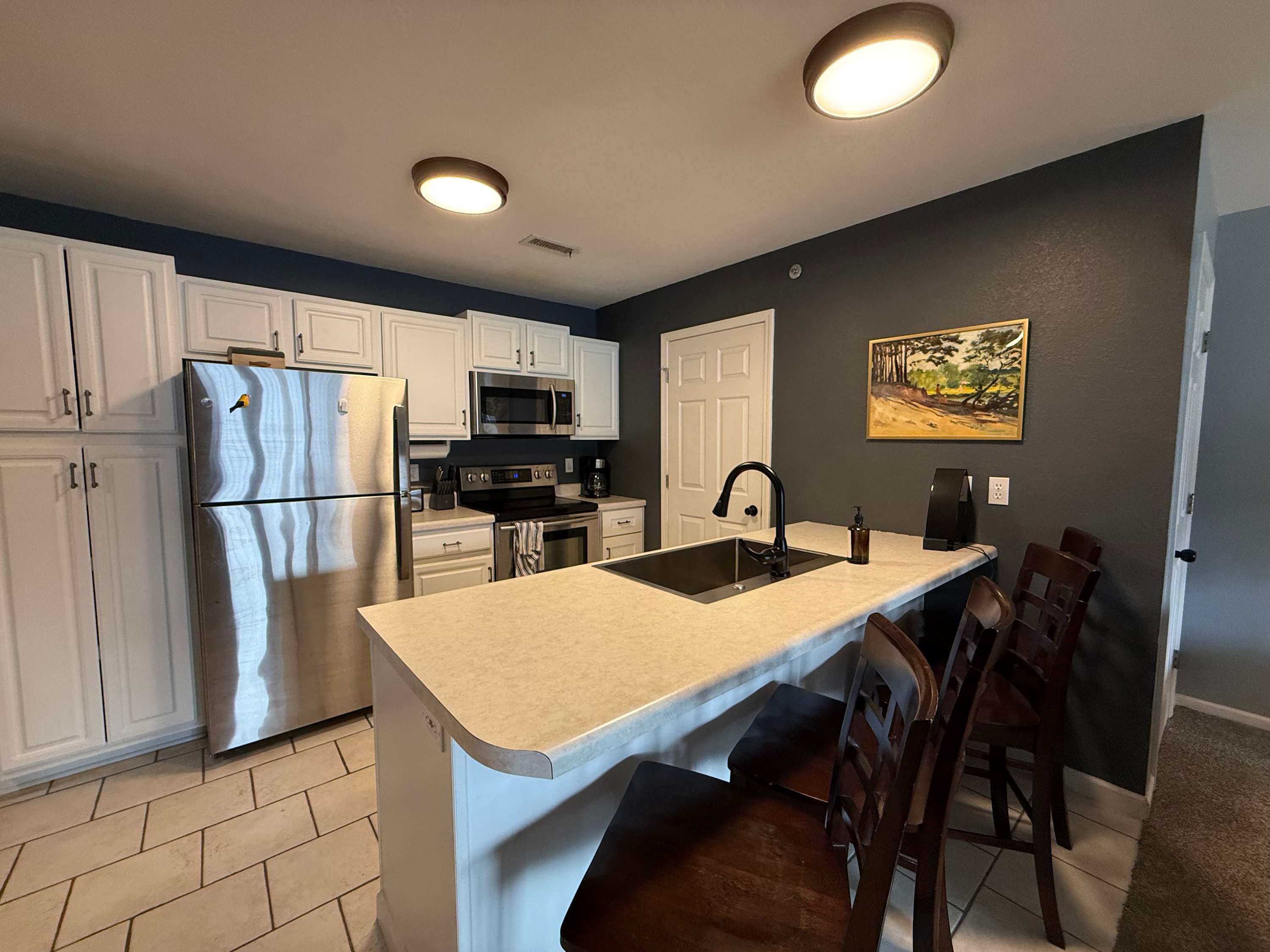 The open kitchen offers ample space & all the comforts of home​