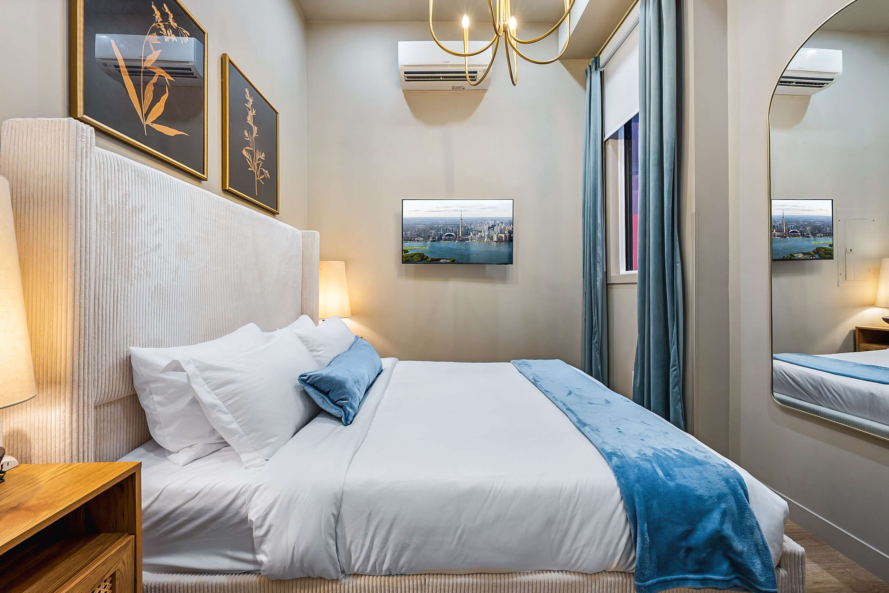 Serene bedroom with a plush queen bed and a smart TV.